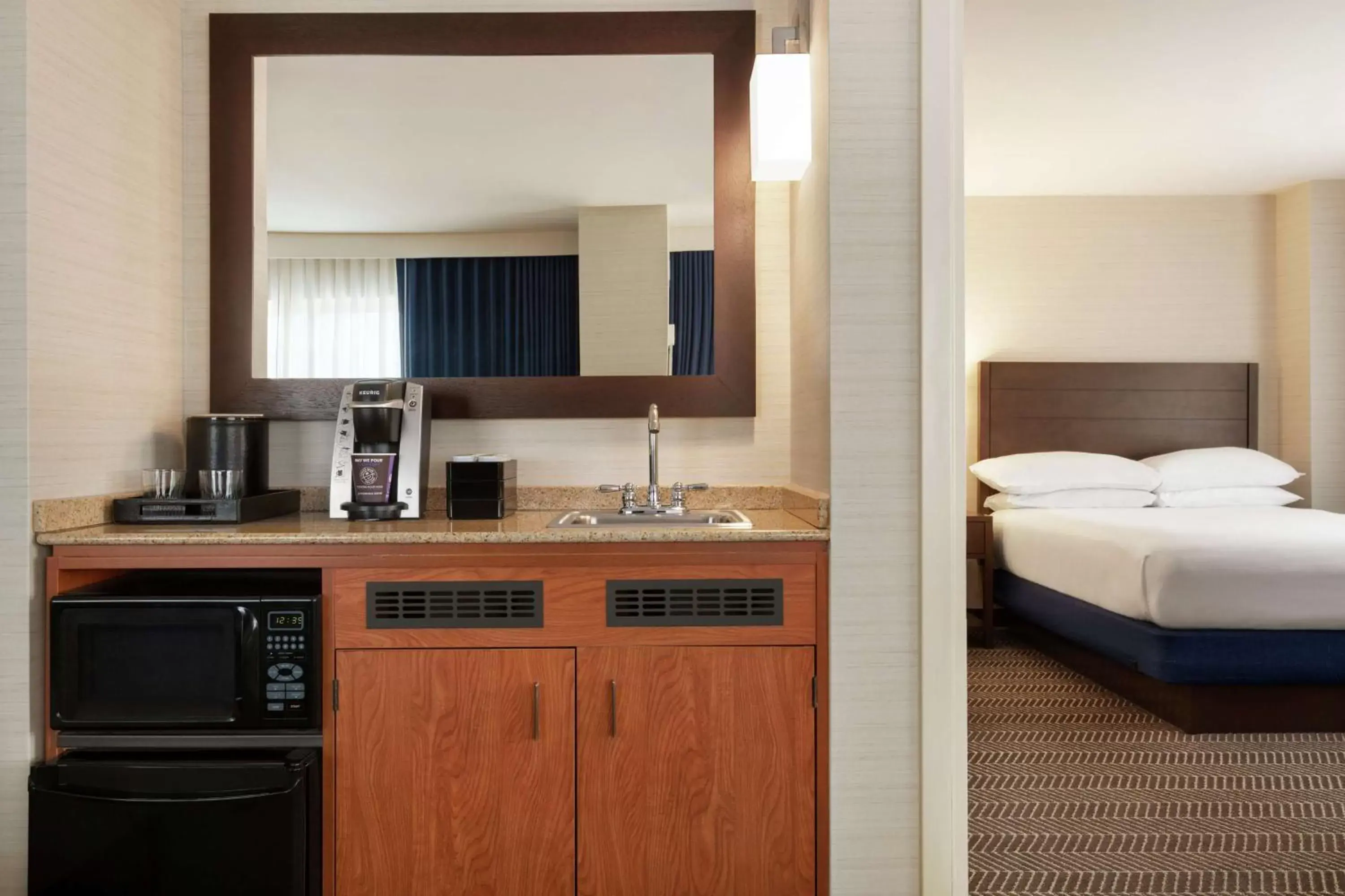 Kitchen or kitchenette, Bathroom in Embassy Suites Boston at Logan Airport