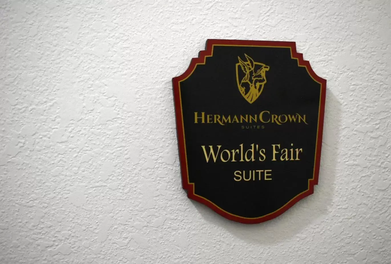 Property logo or sign in Hermann Crown Suites