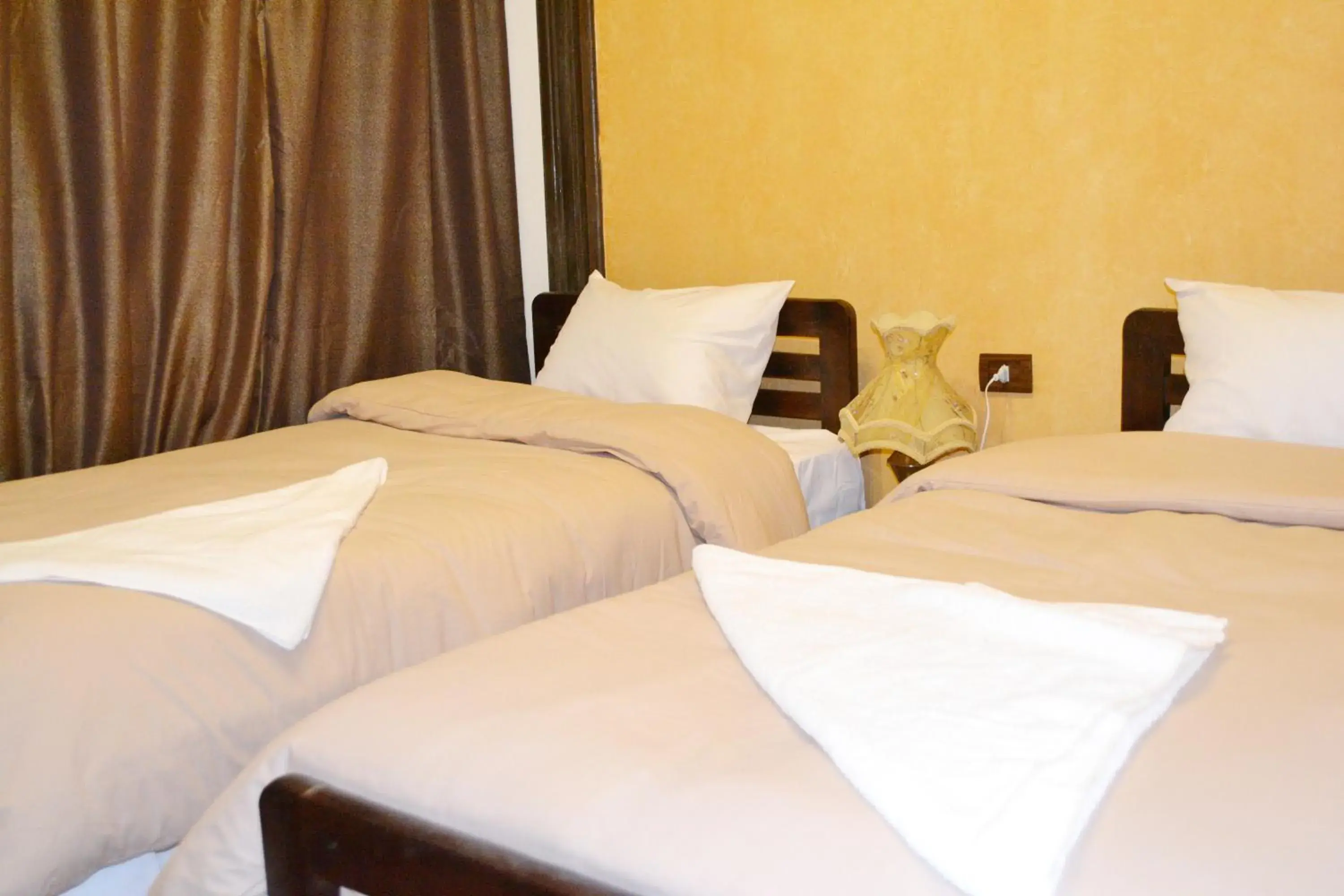 Bed in Cecilia Hotel