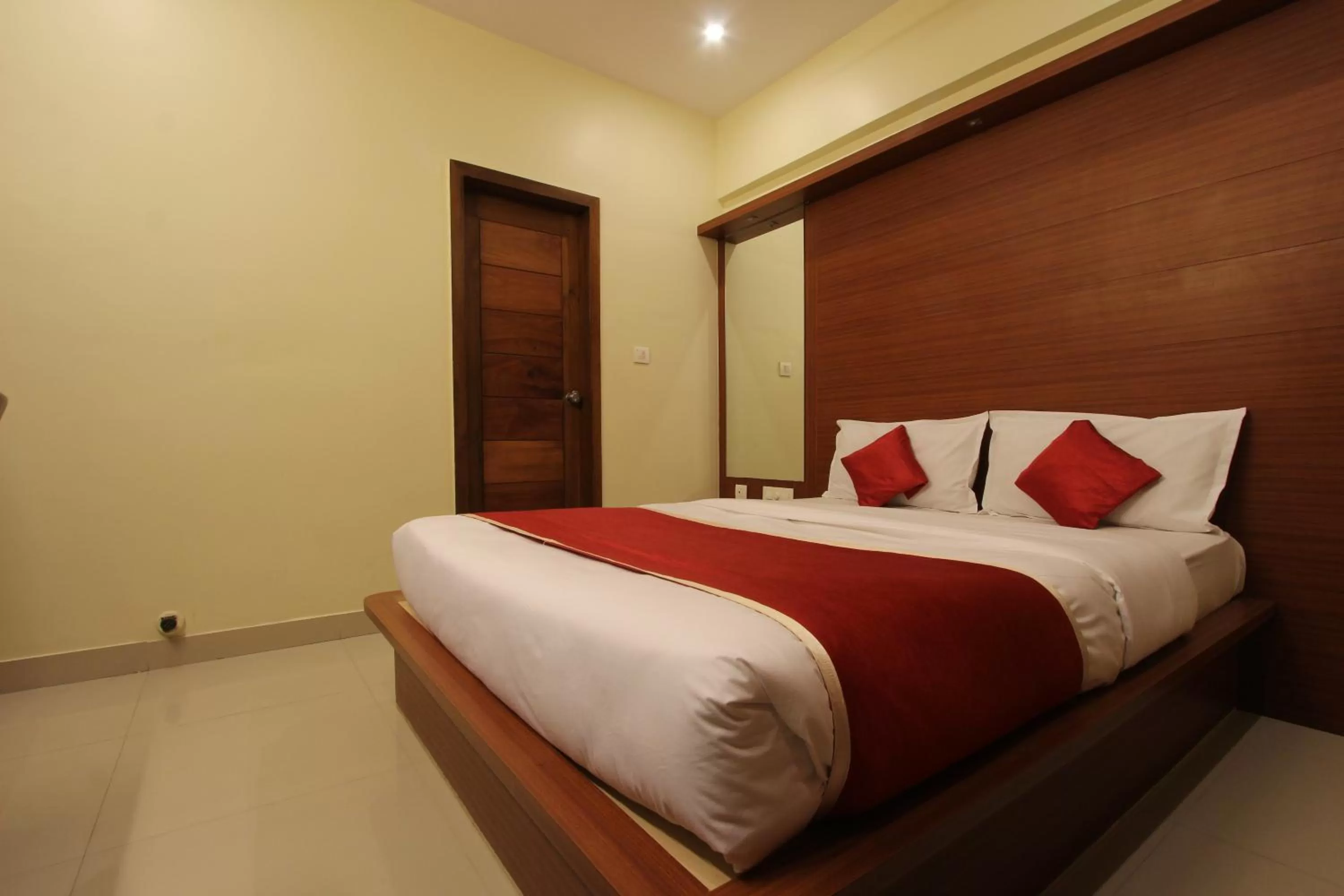 Bed in The Grand Inn Mysore