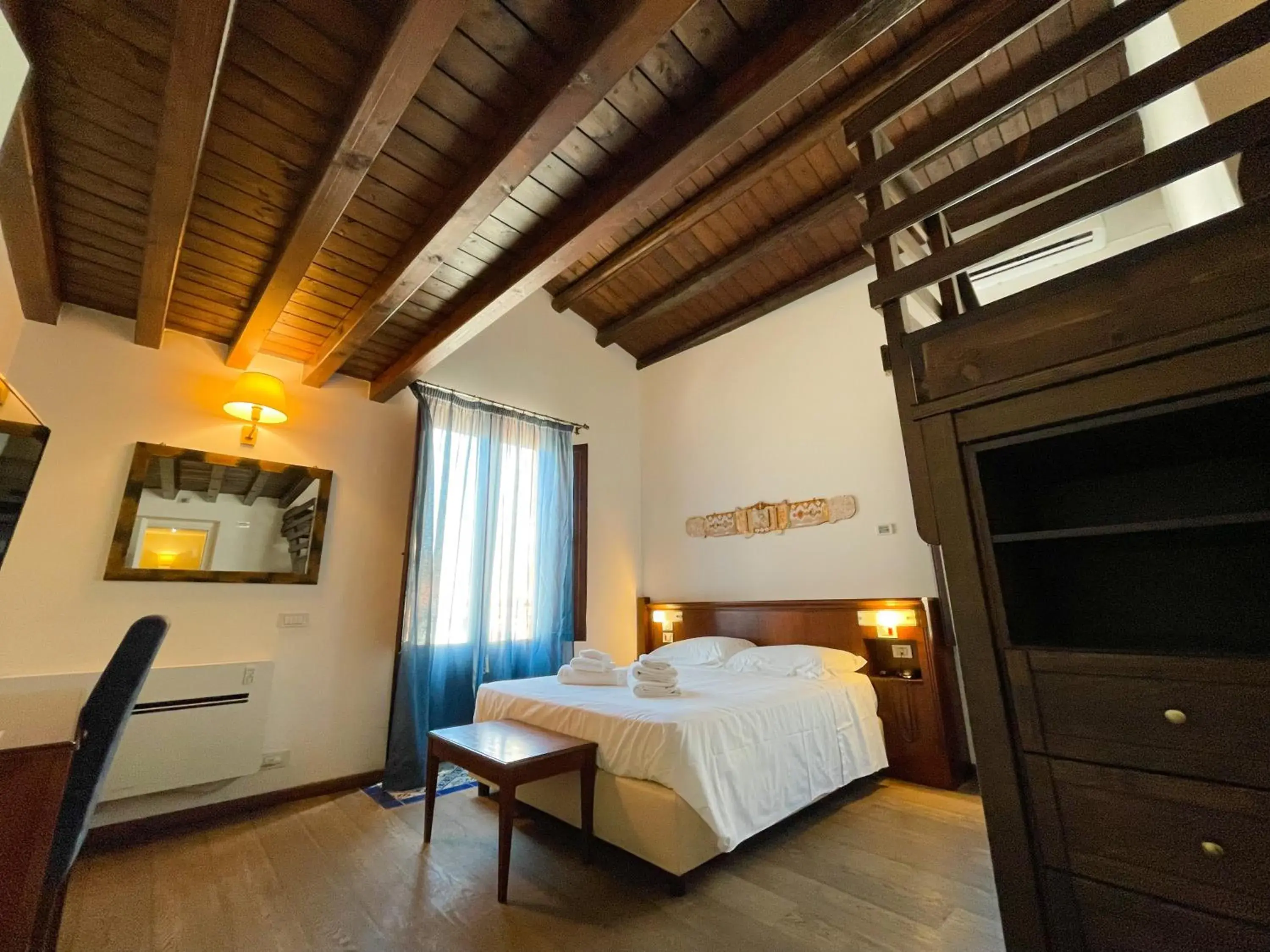 Bed in Hotel La Plumeria
