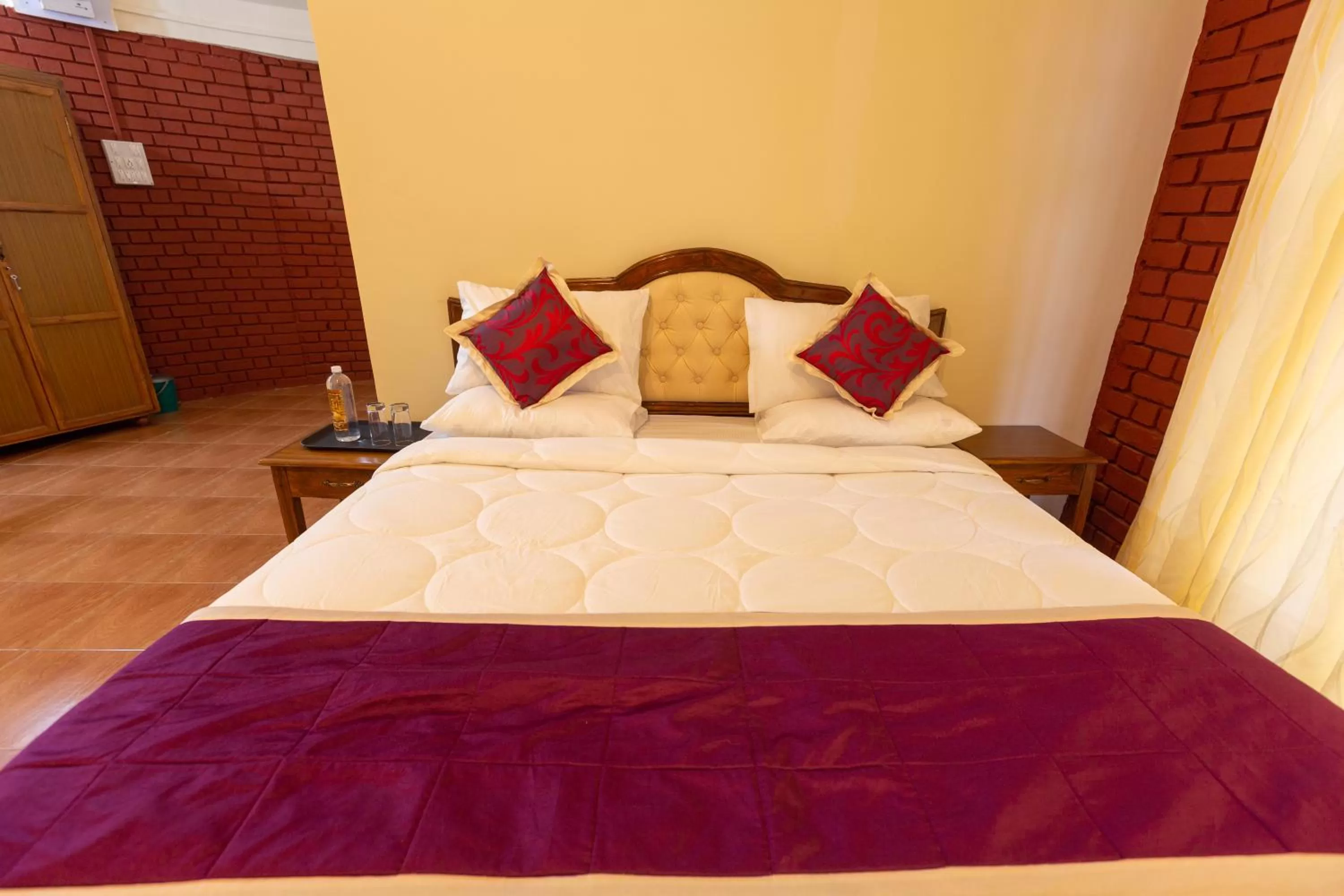 Bed in KSTDC Hotel Mayura Krishna Almatti