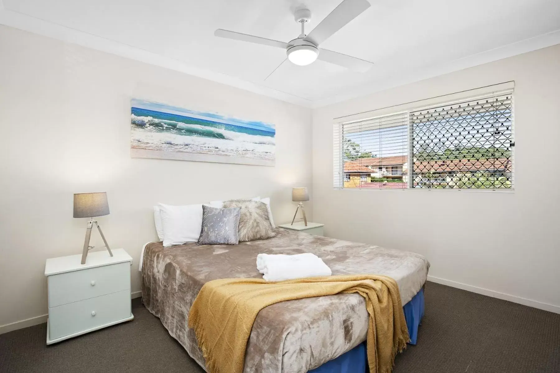 Bed in Kirra Palms Holiday Apartments