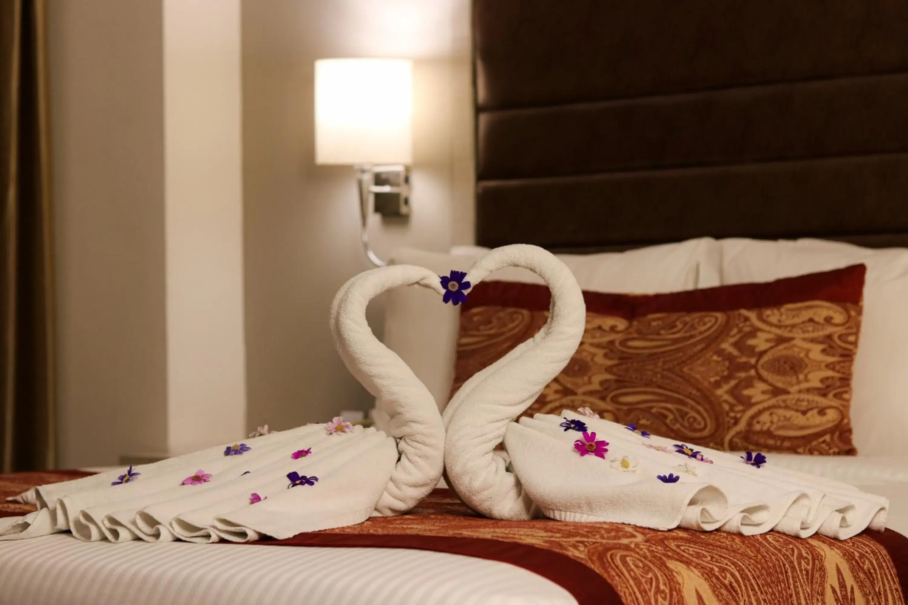 Bed in Mahagun Sarovar Portico Suites Ghaziabad