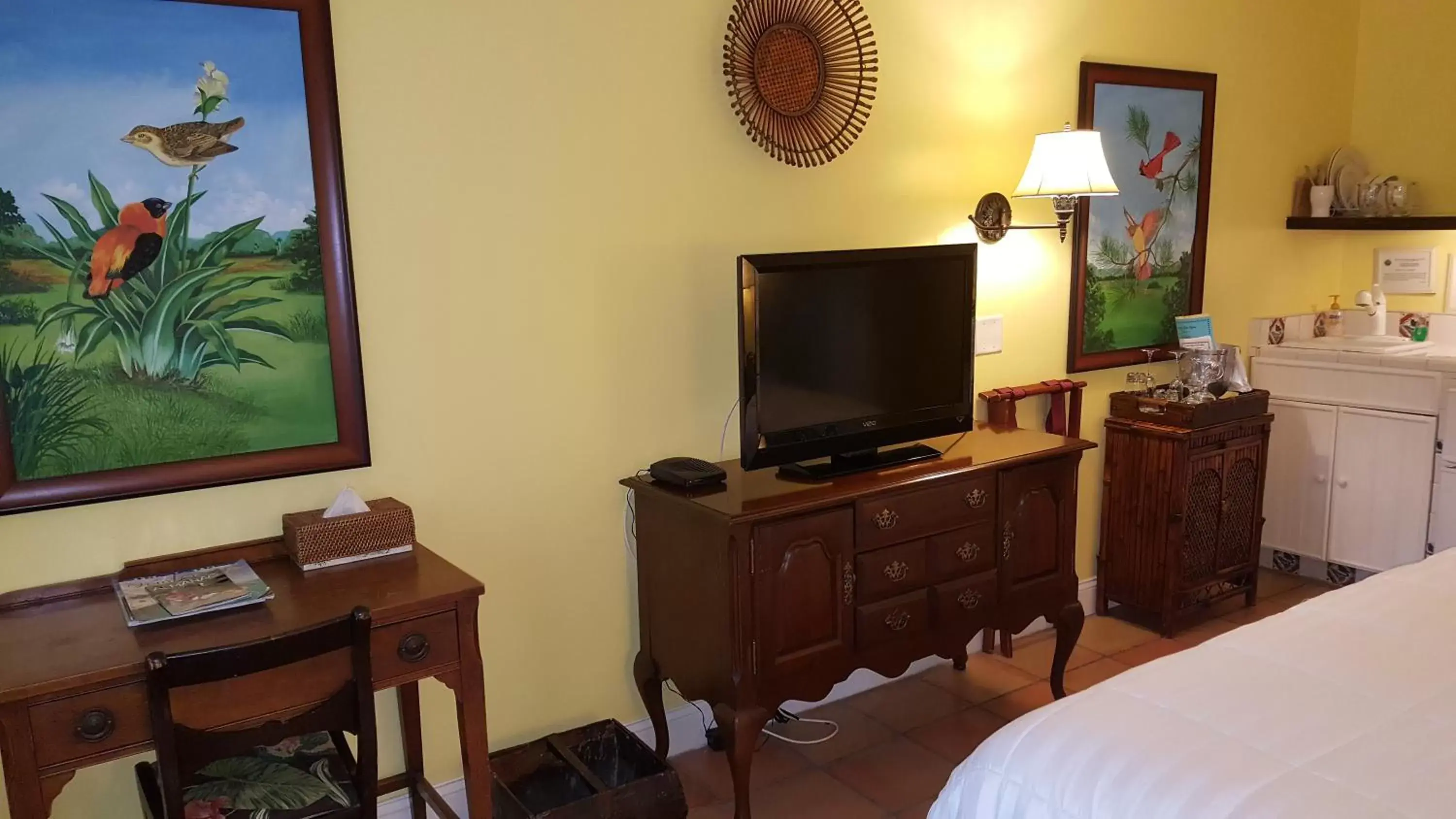 Photo of the whole room, TV/Entertainment Center in The Caribbean Court Boutique Hotel