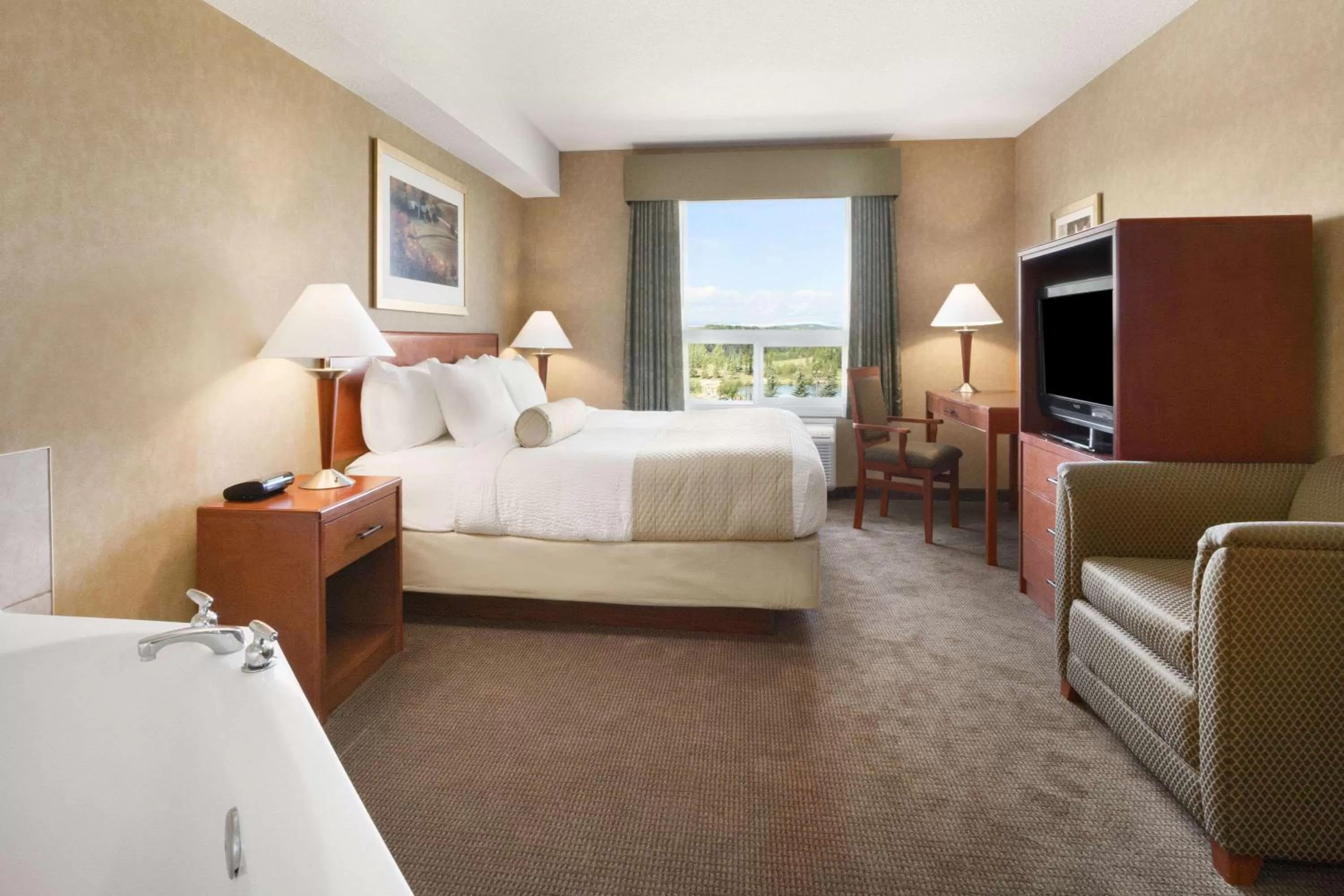 Photo of the whole room, Bed in Days Inn & Suites by Wyndham Cochrane