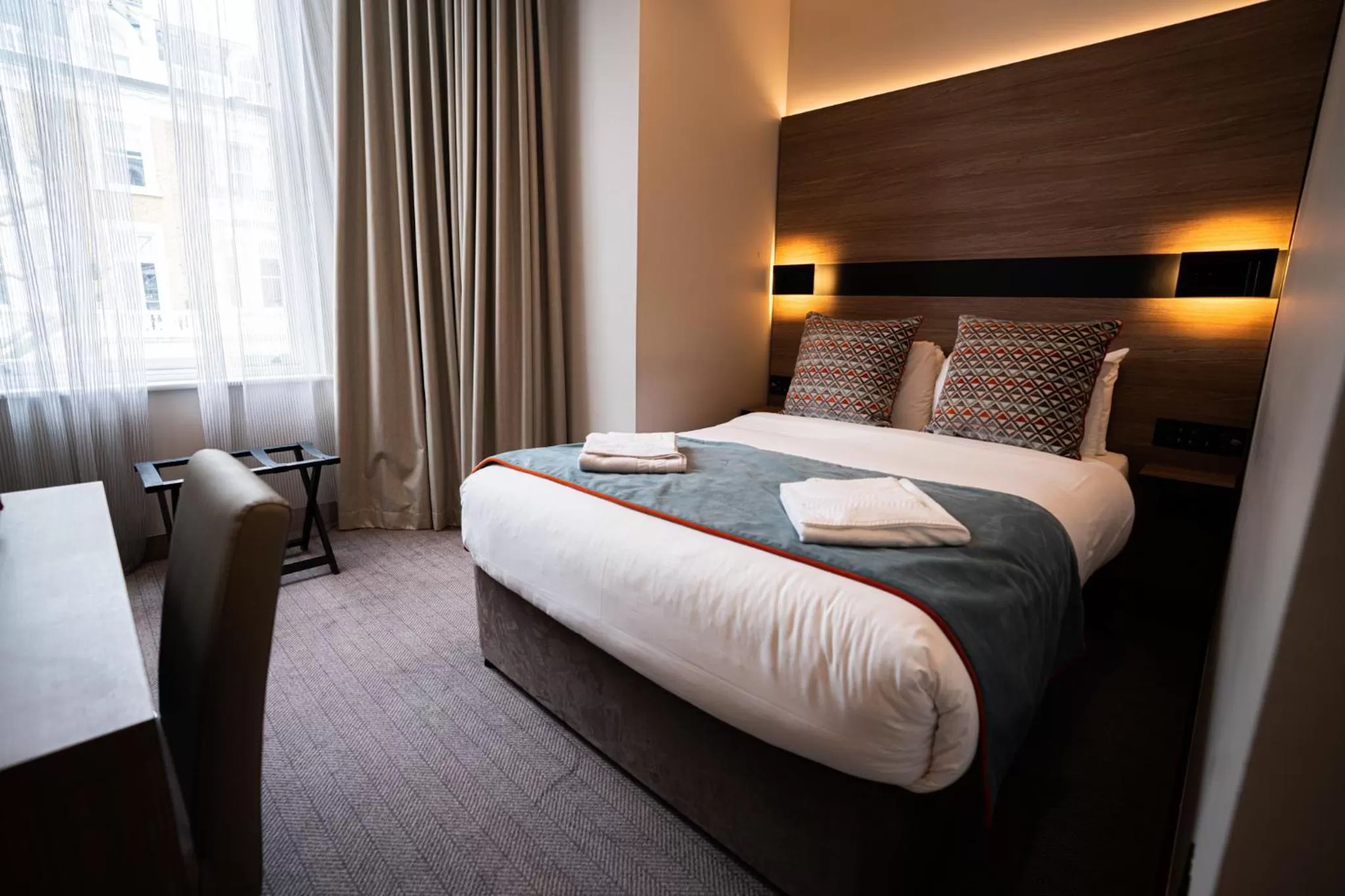 Bed in Merit Kensington Hotel