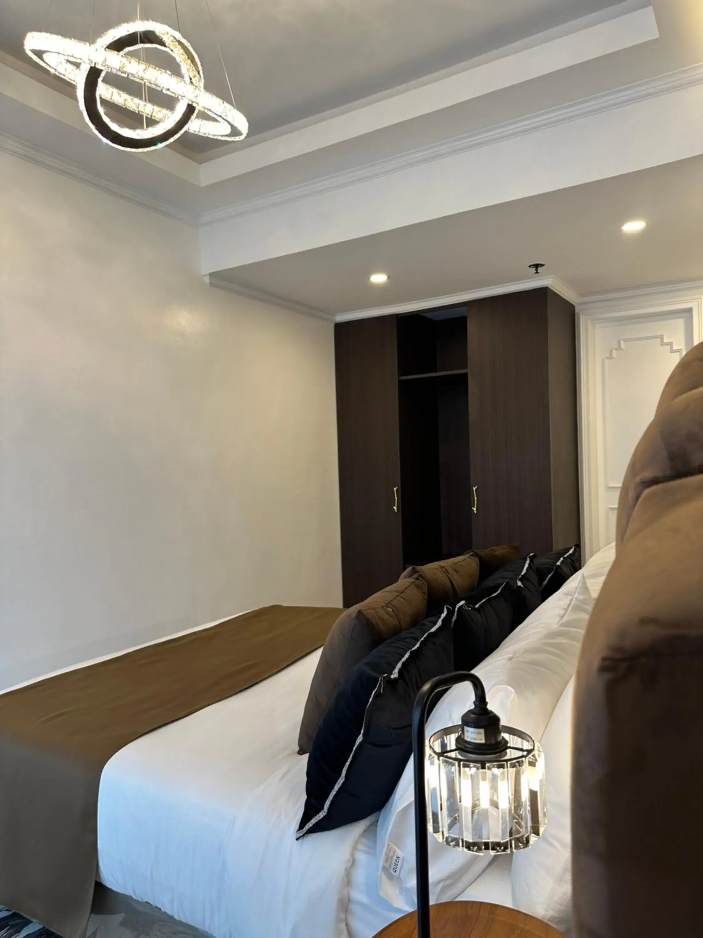 Bed, Seating Area in Mpt Suites