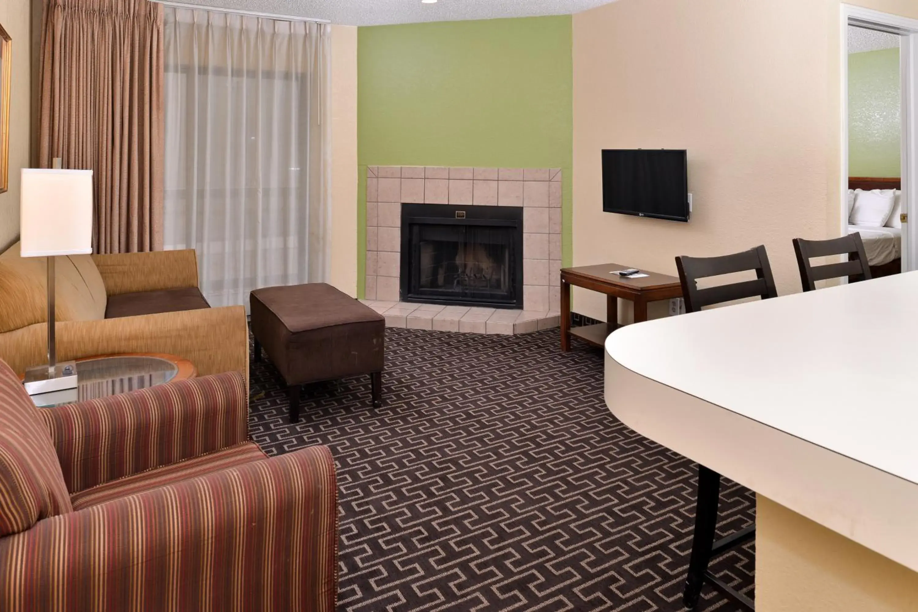 Living room, Seating Area in Americas Best Value Inn & Suites Extended Stay - Tulsa