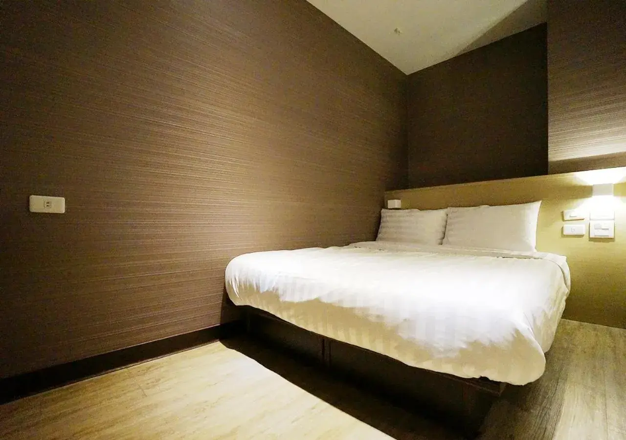 Bed in Win Inn Kaohsiung Hotel