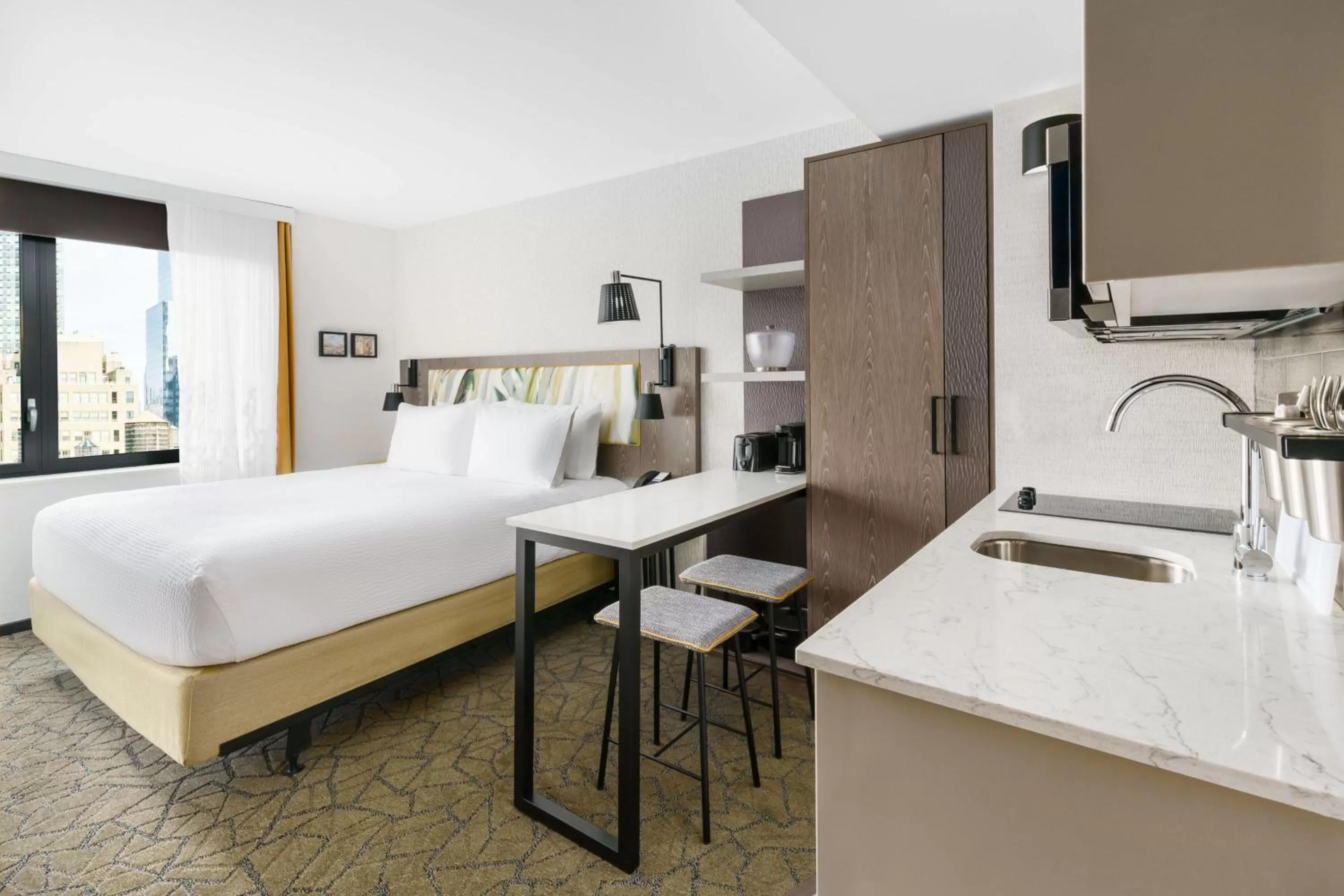 Kitchen or kitchenette, Bed in TownePlace Suites by Marriott New York Manhattan/Chelsea