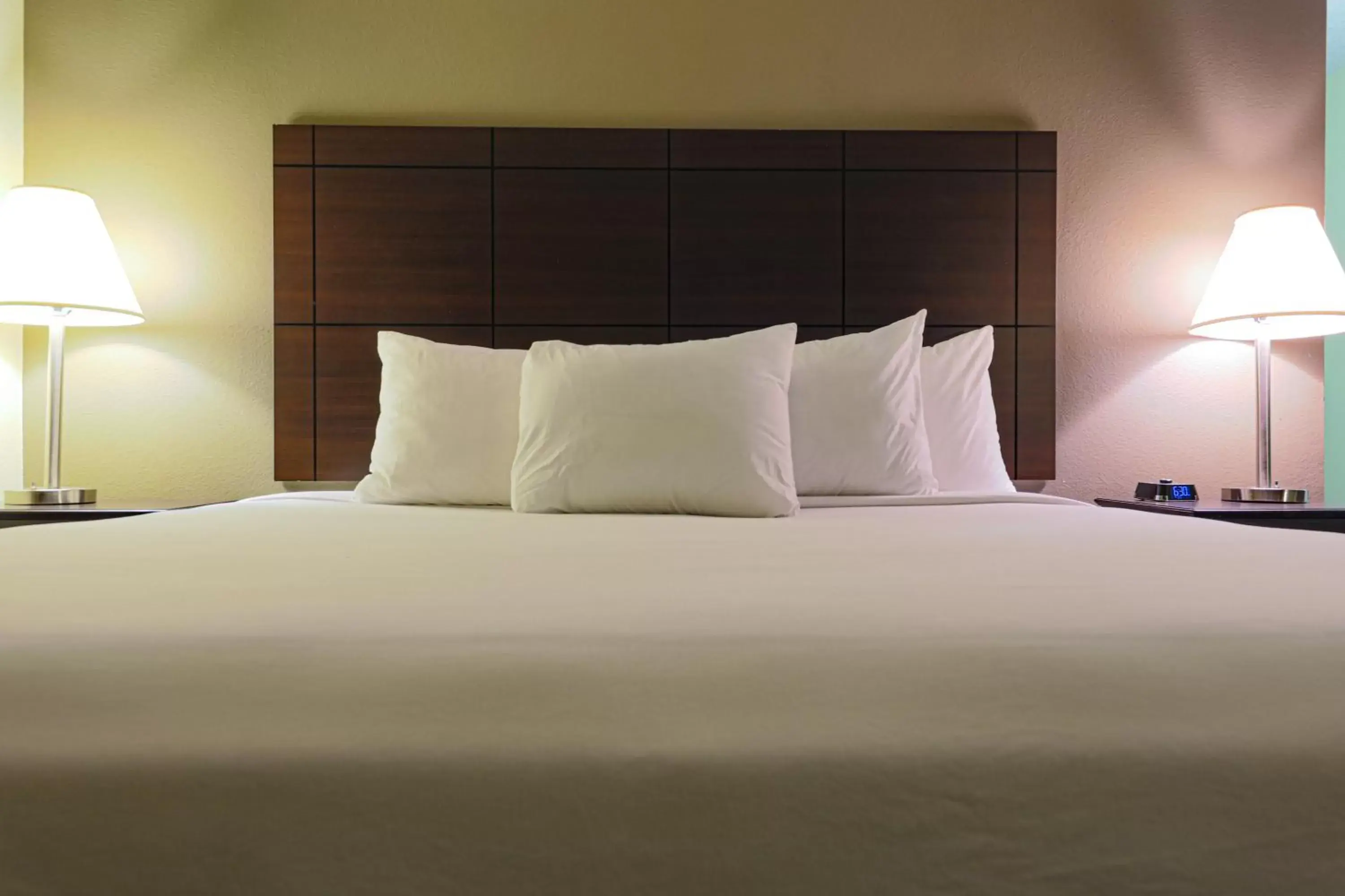 Bed in AmericInn by Wyndham Lincoln South