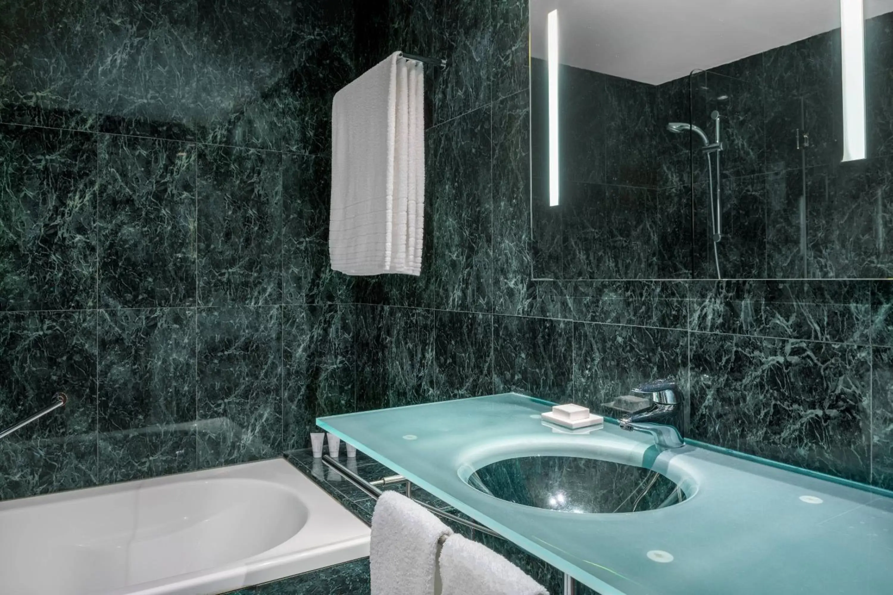 Bathroom in AC Hotel Huelva by Marriott
