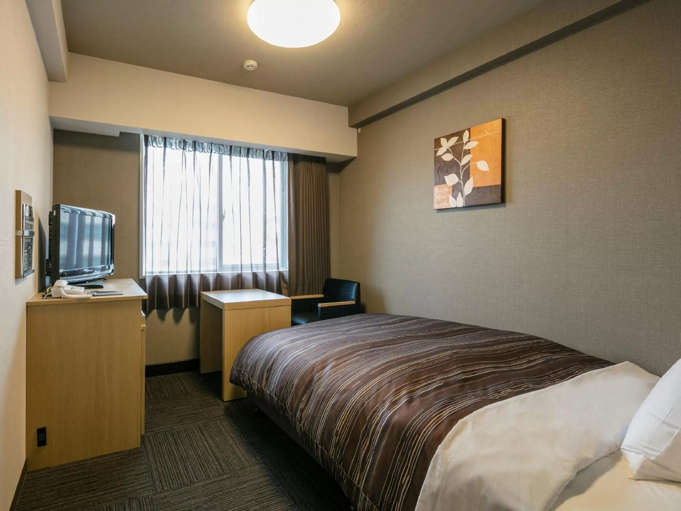 Photo of the whole room, Bed in Hotel Route-Inn Kumamoto Ekimae Photo of the whole room, Bed in Hotel Route-Inn Kumamoto Ekimae