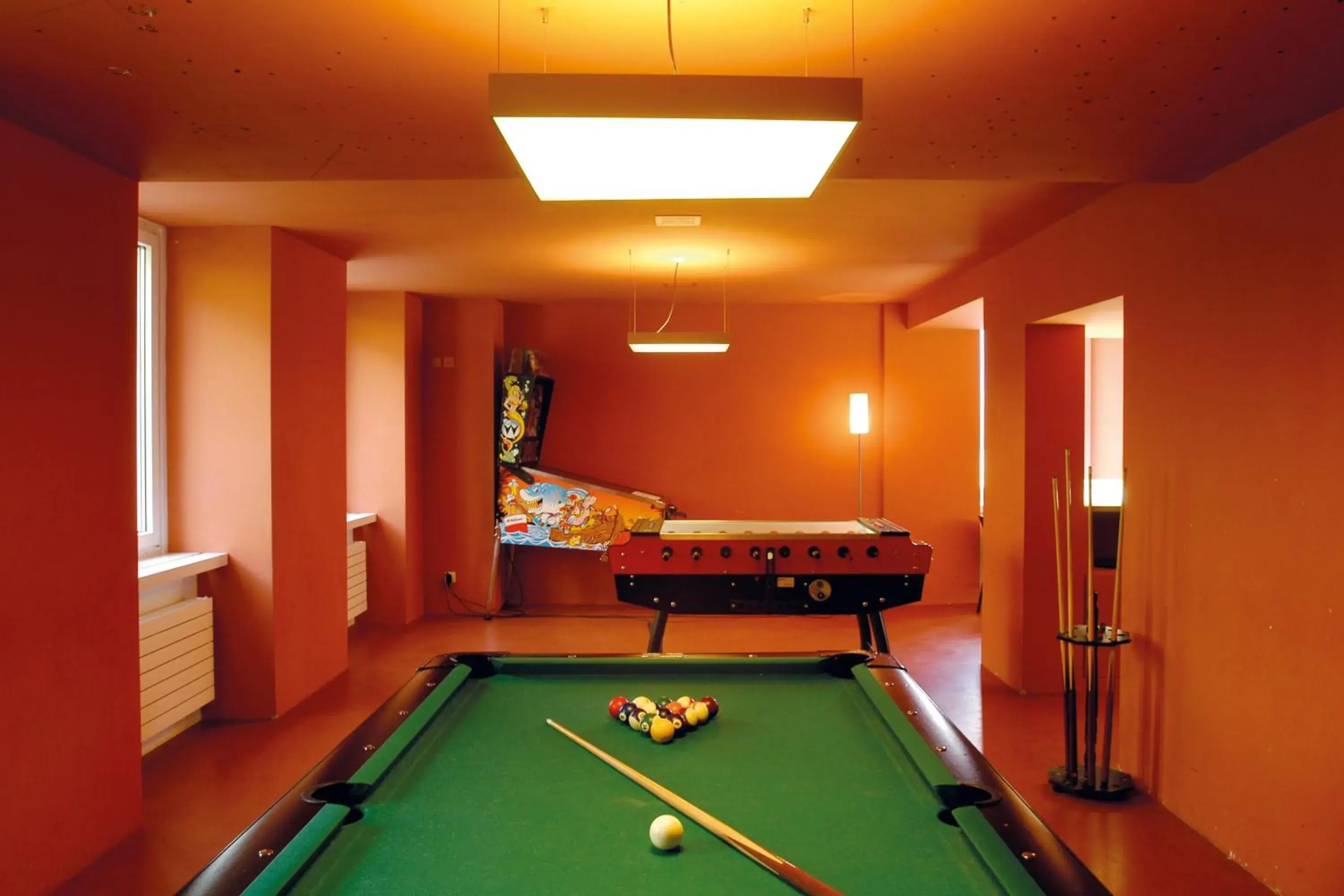 Communal lounge/ TV room, Billiards in Davos Youth Hostel