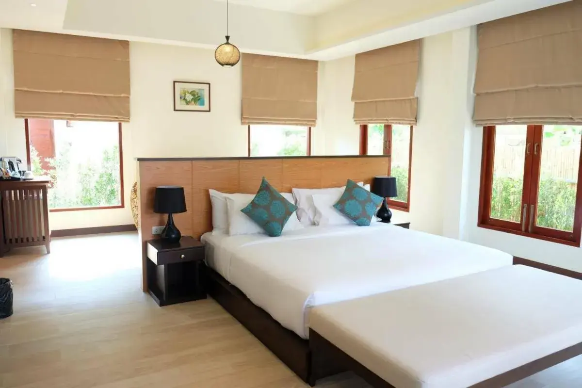 Bed in Triple Tree Beach Resort