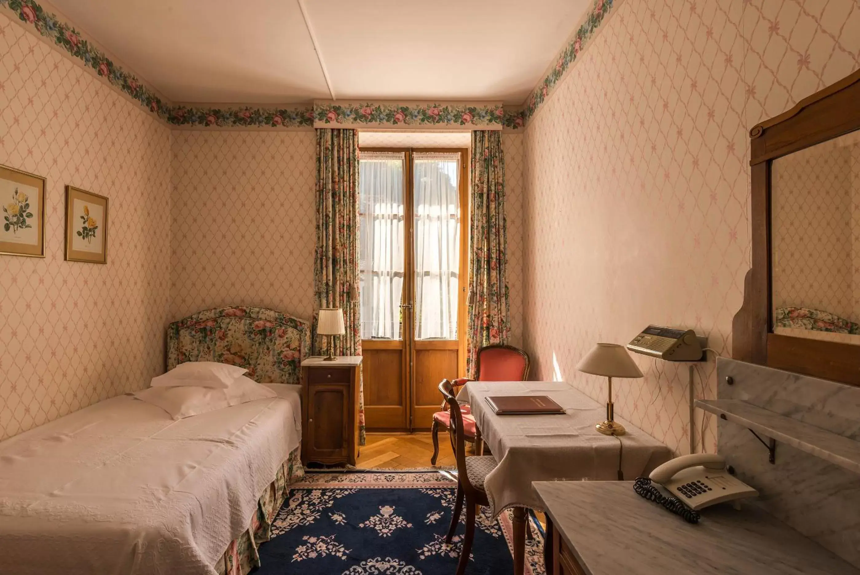 Bed, Seating Area in Swiss Historic Hotel Masson