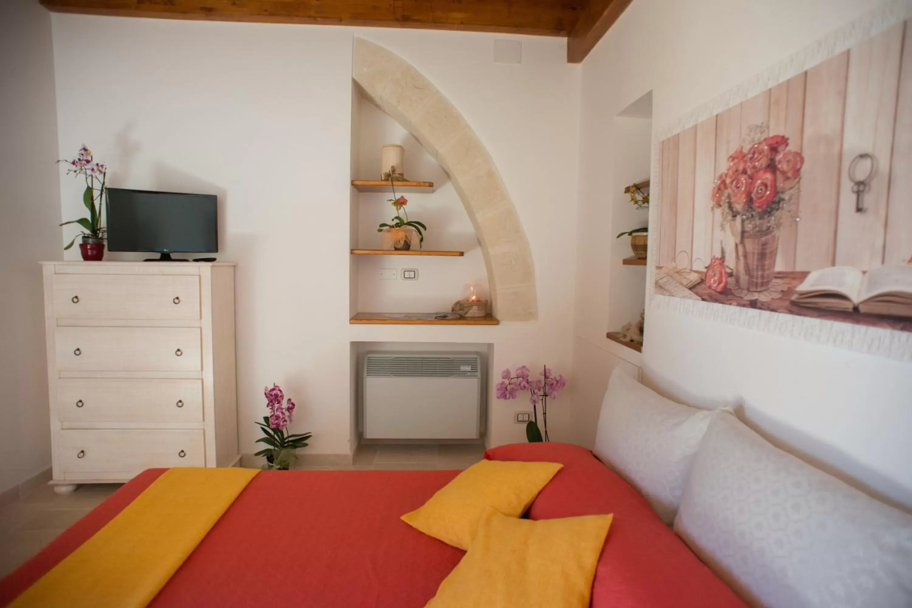 Bed in Grandi Trulli Bed & Breakfast