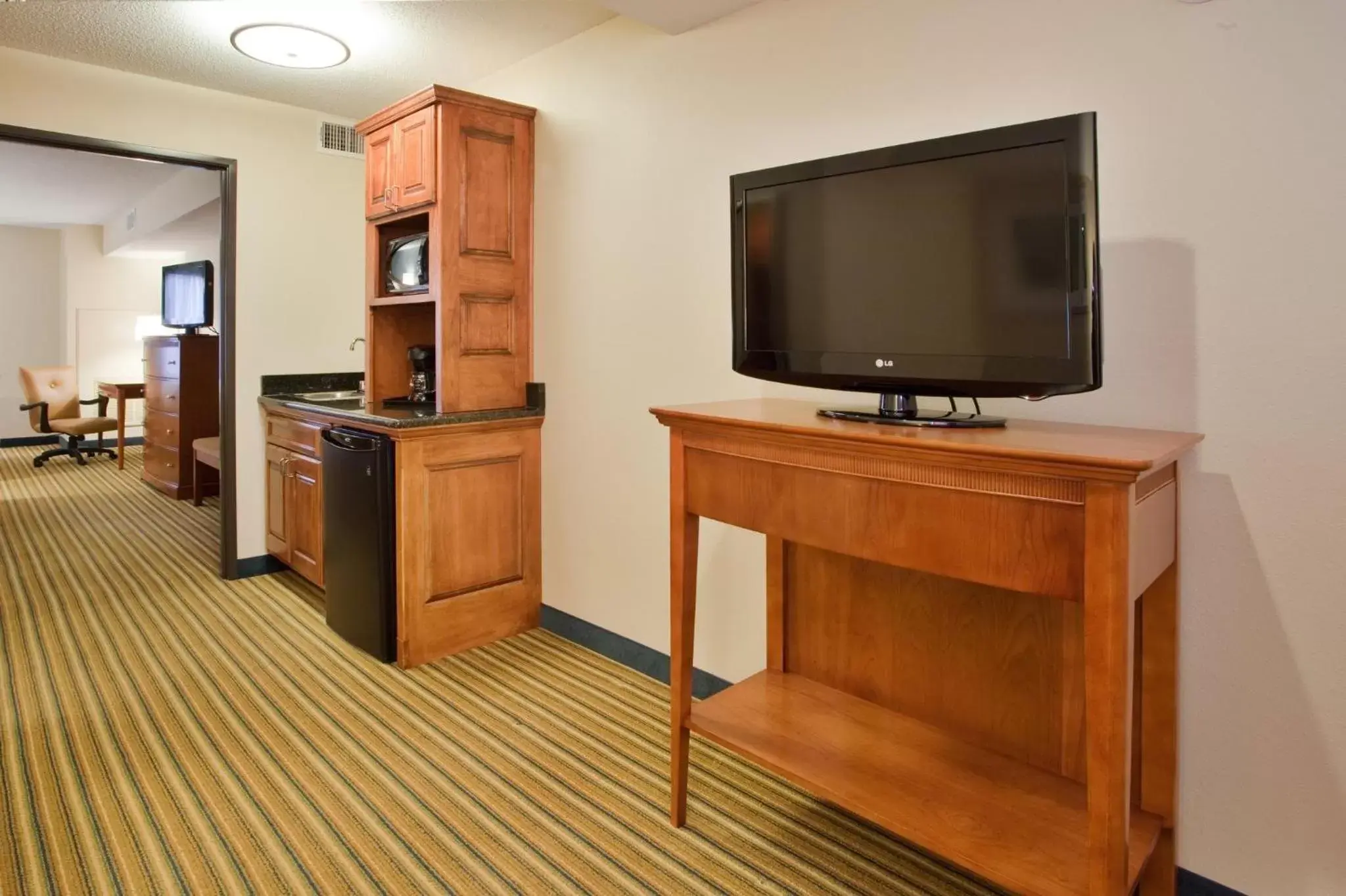 Photo of the whole room, TV/Entertainment Center in Holiday Inn Express Hotel & Suites Fredericksburg, an IHG Hotel