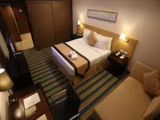 Photo of the whole room, Bed in Luxent Hotel