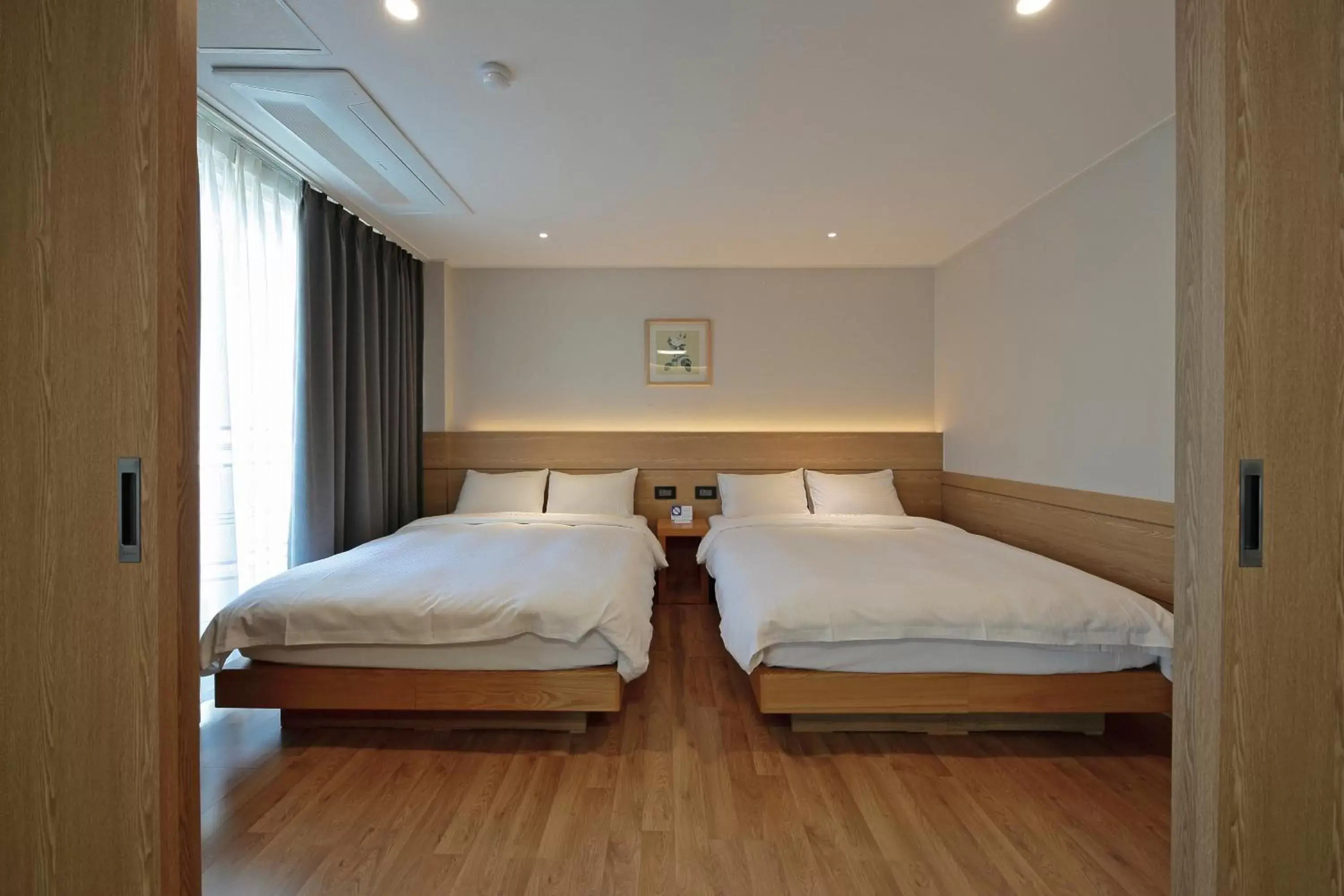 Bed in Benikea Swiss Rosen Hotel