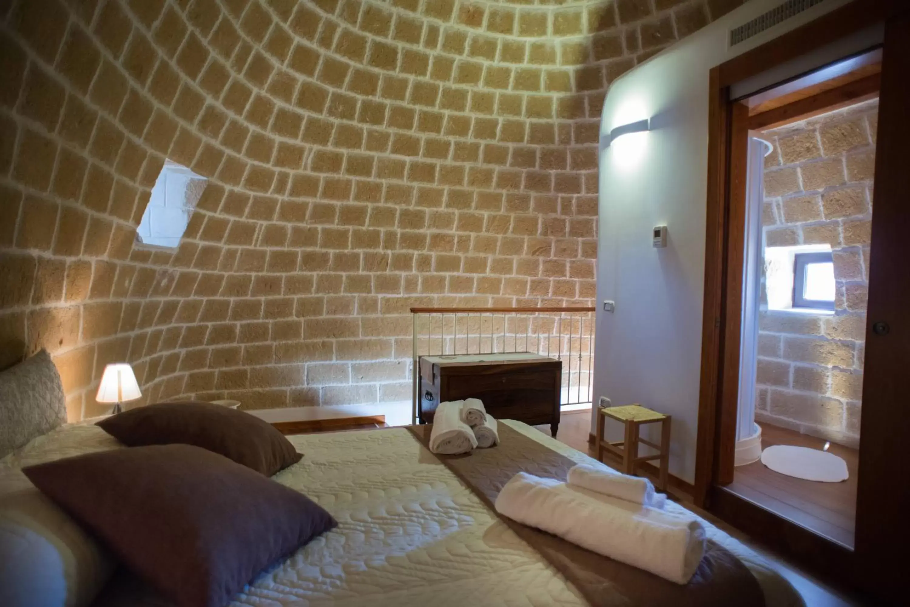 Bed in Grandi Trulli Bed & Breakfast