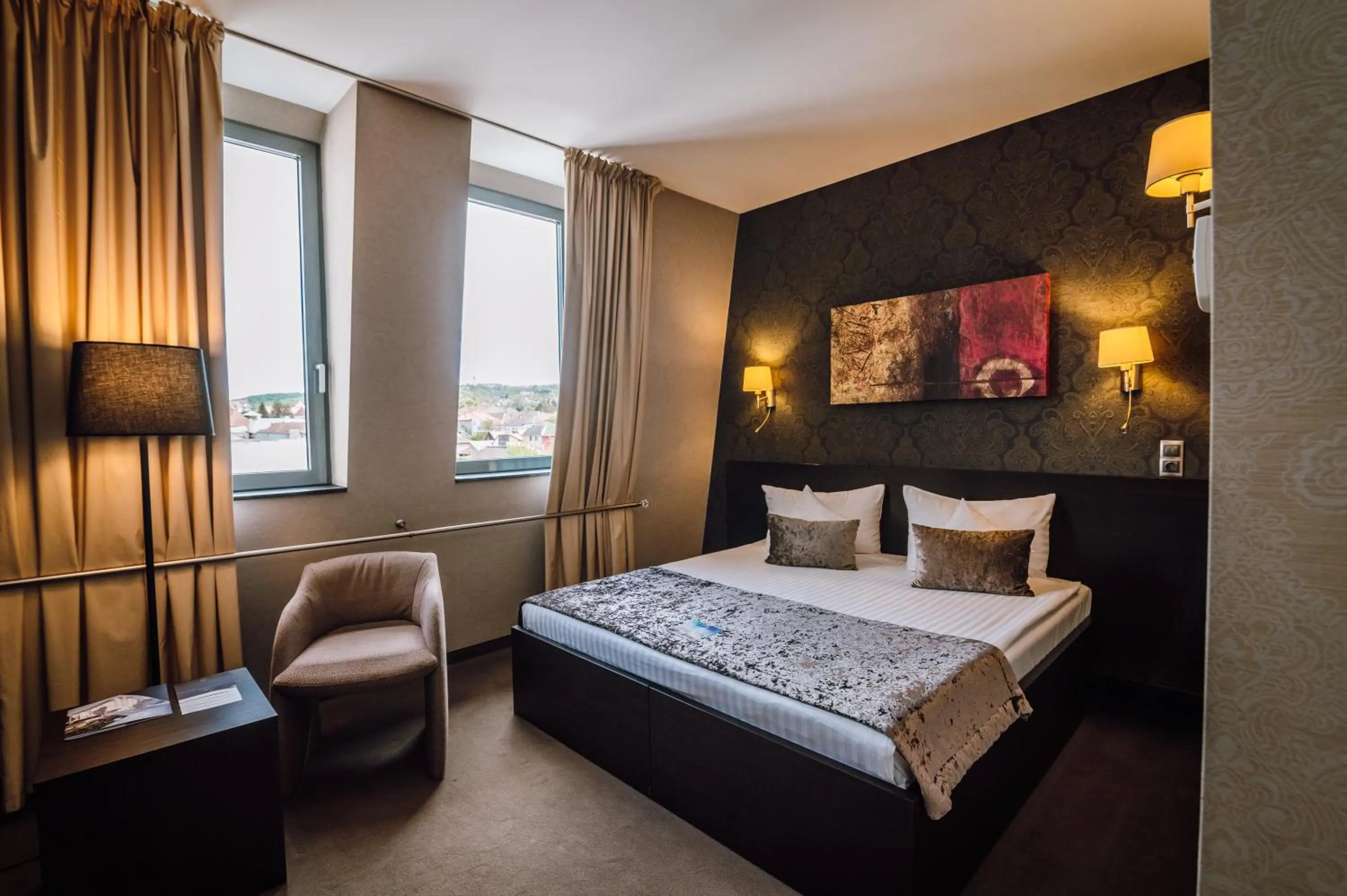 Bed in Plaza V Executive Hotel