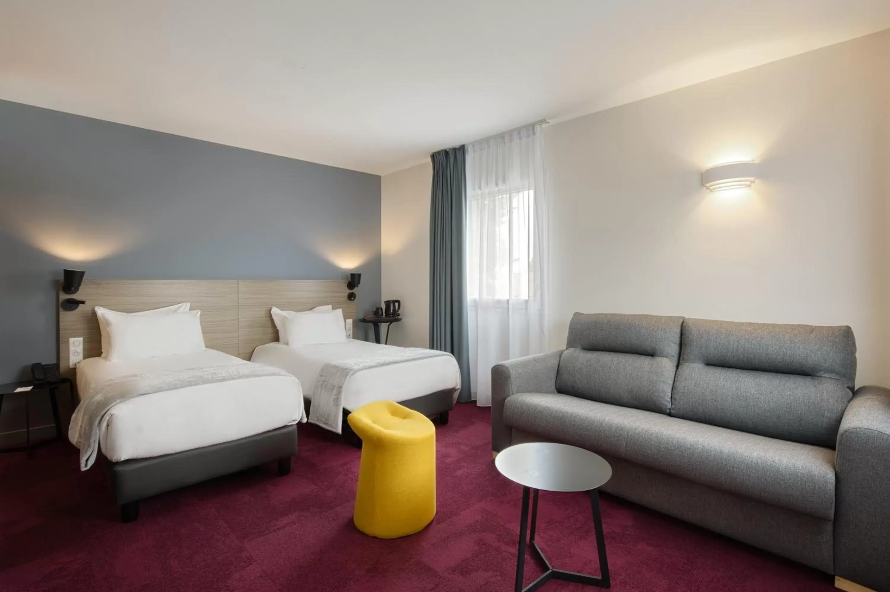 Seating area in Sure Hotel by Best Western Les Portes de Montauban