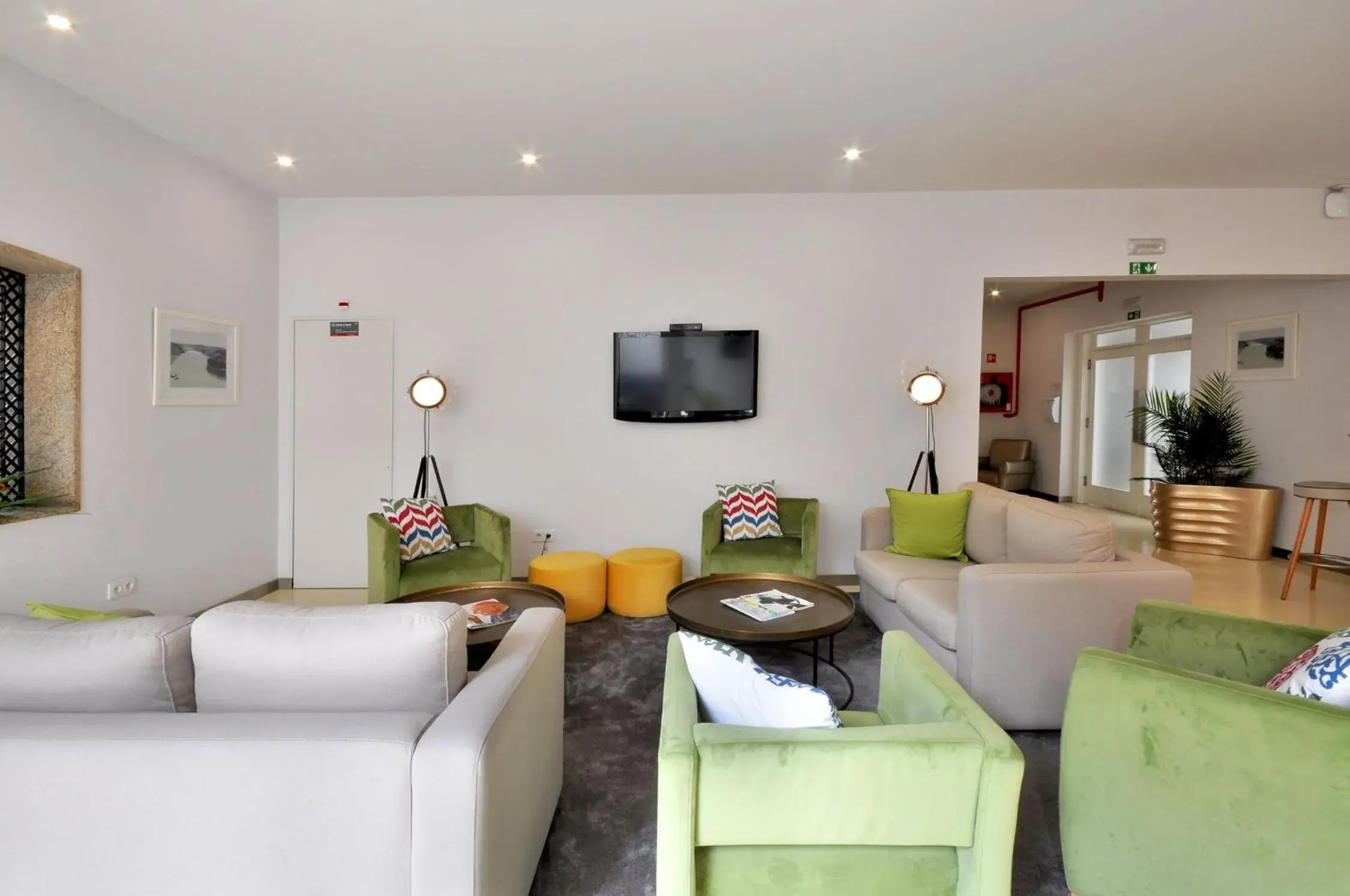 Communal lounge/ TV room, Seating Area in Porto Domus Hotel