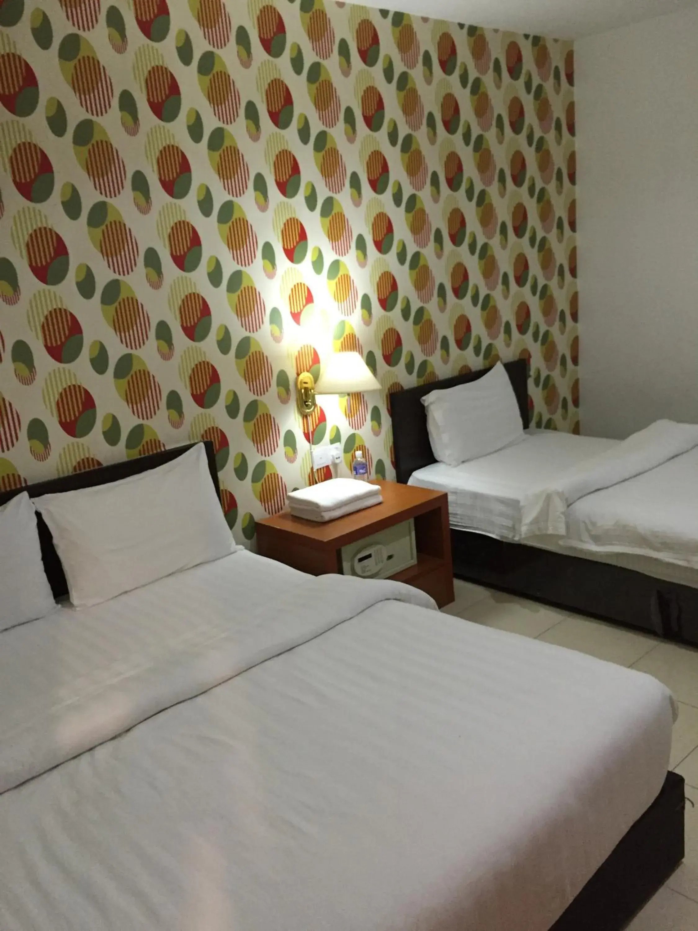 Bed in Permai Hotel