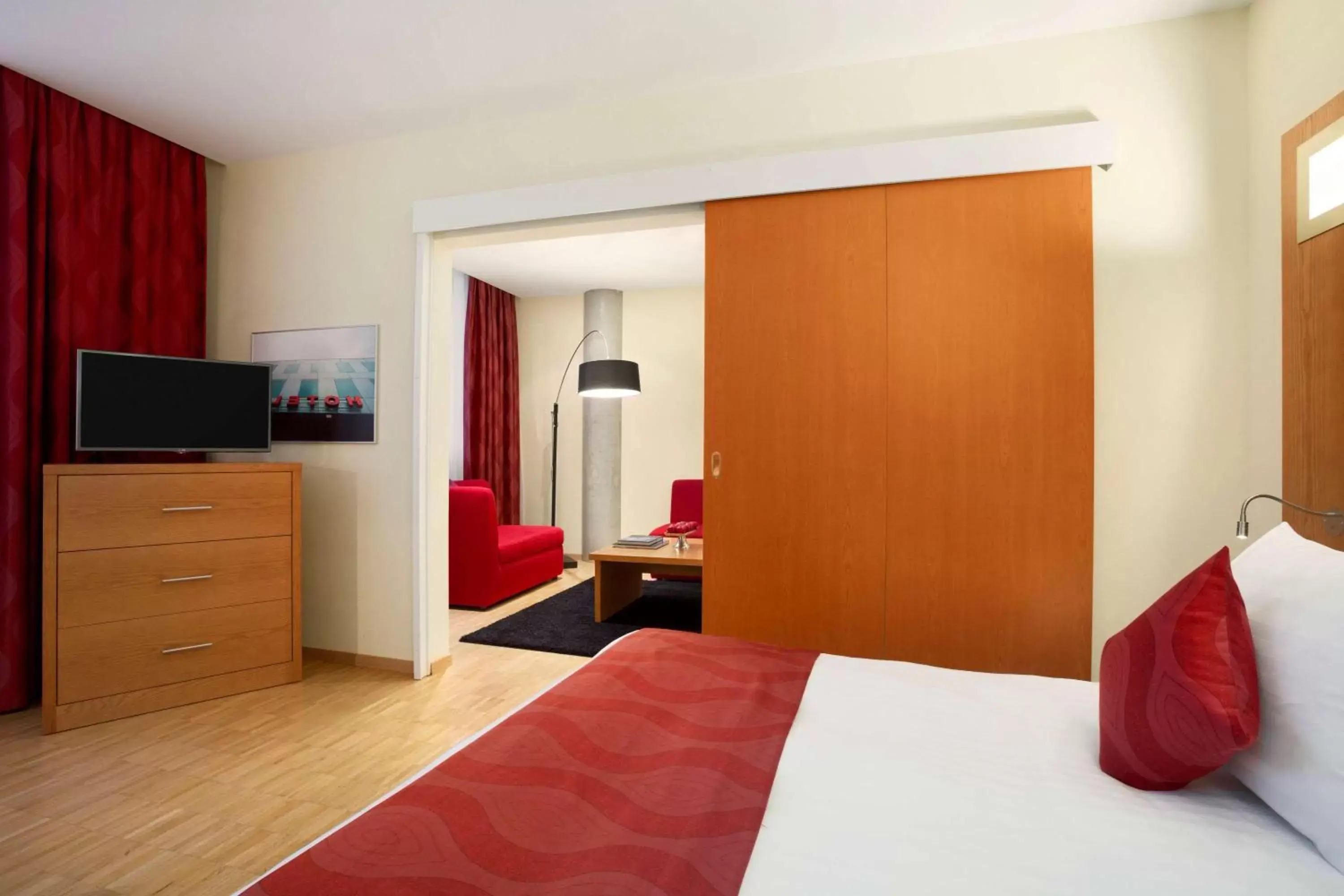 Photo of the whole room, Bed in Ramada Encore by Wyndham Geneva