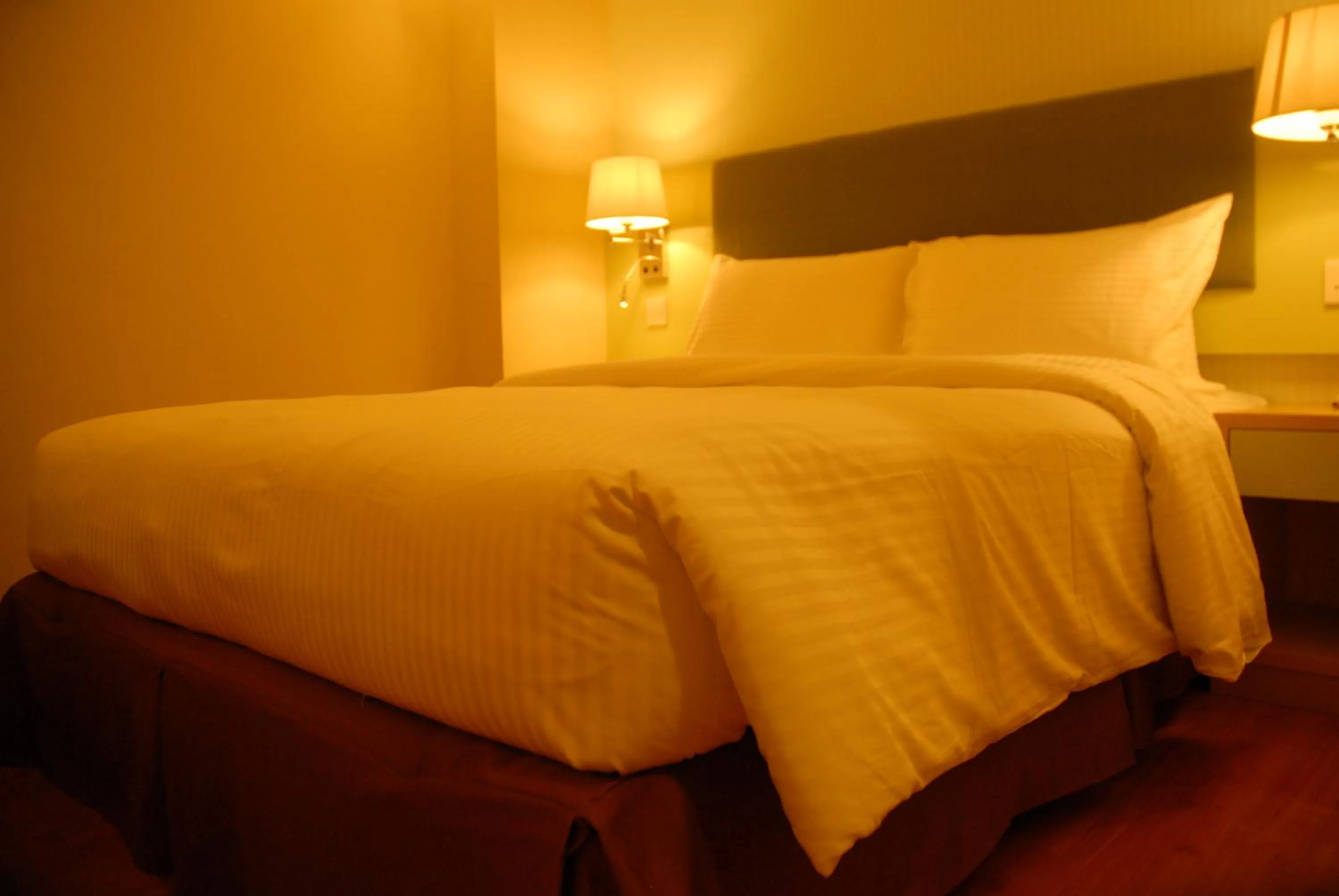 Bed in The Pavilion Hotel