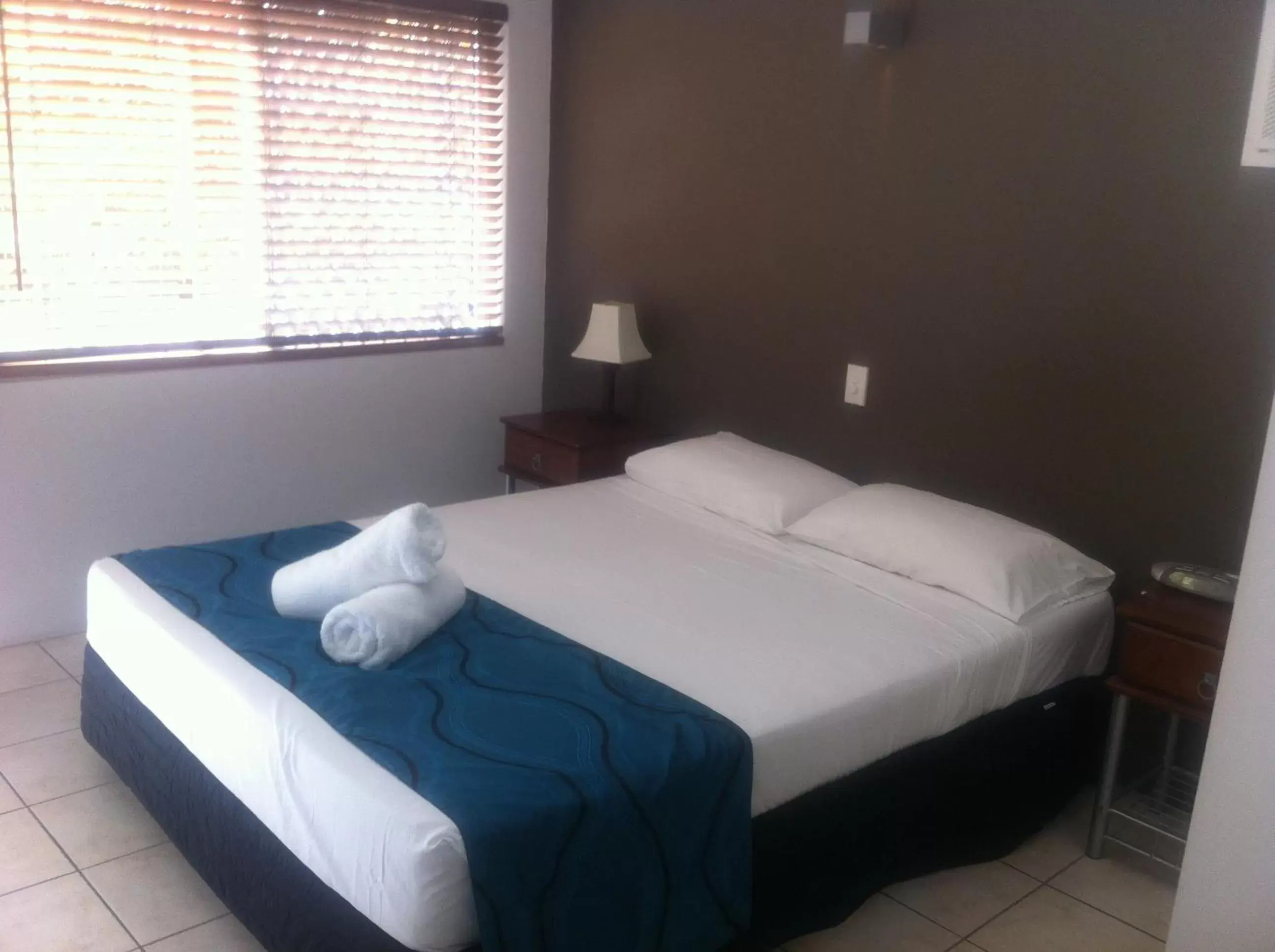 Bed in Reef Gateway Apartments