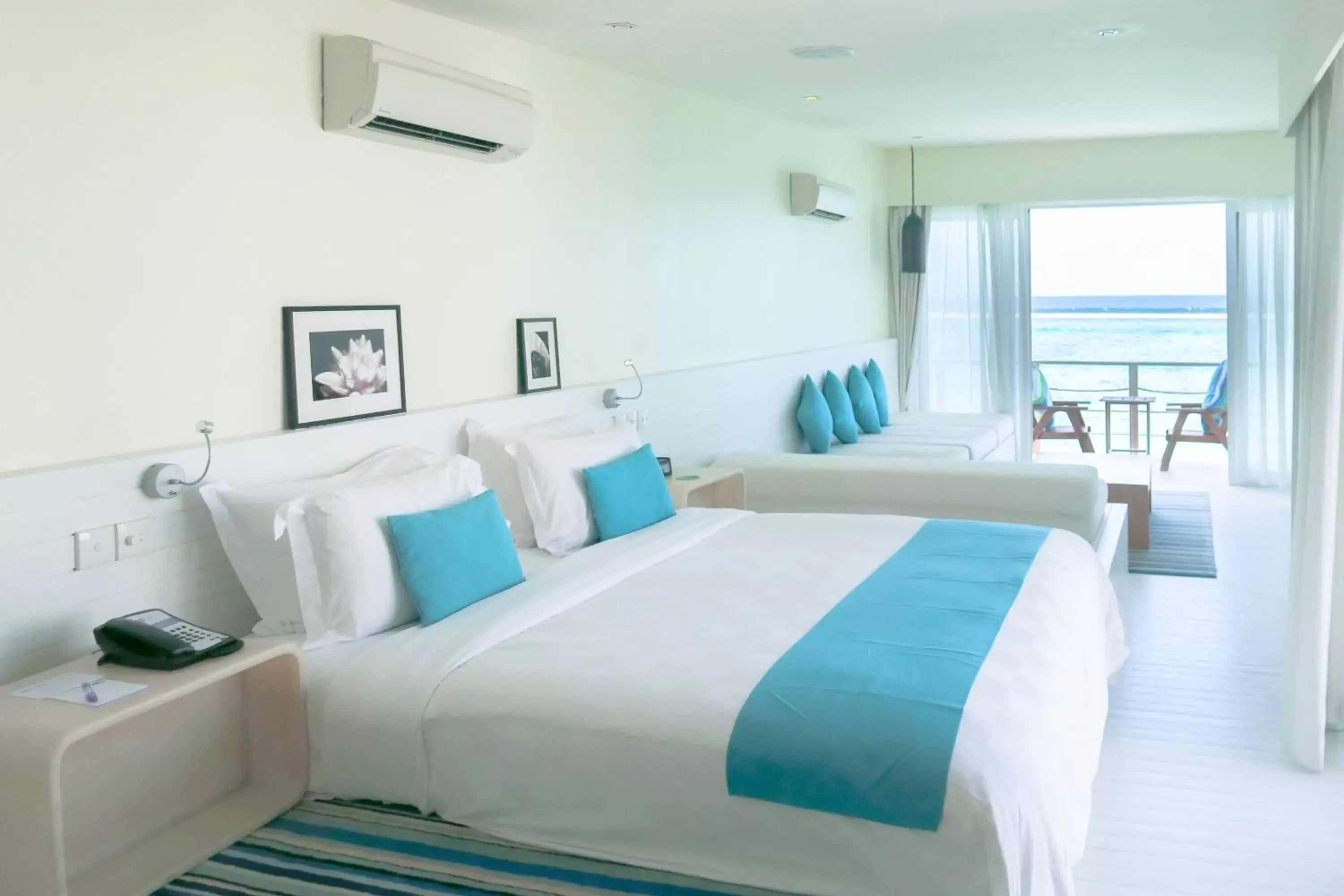 Photo of the whole room, Bed in Holiday Inn Resort Kandooma Maldives - Kids Stay & Eat Free