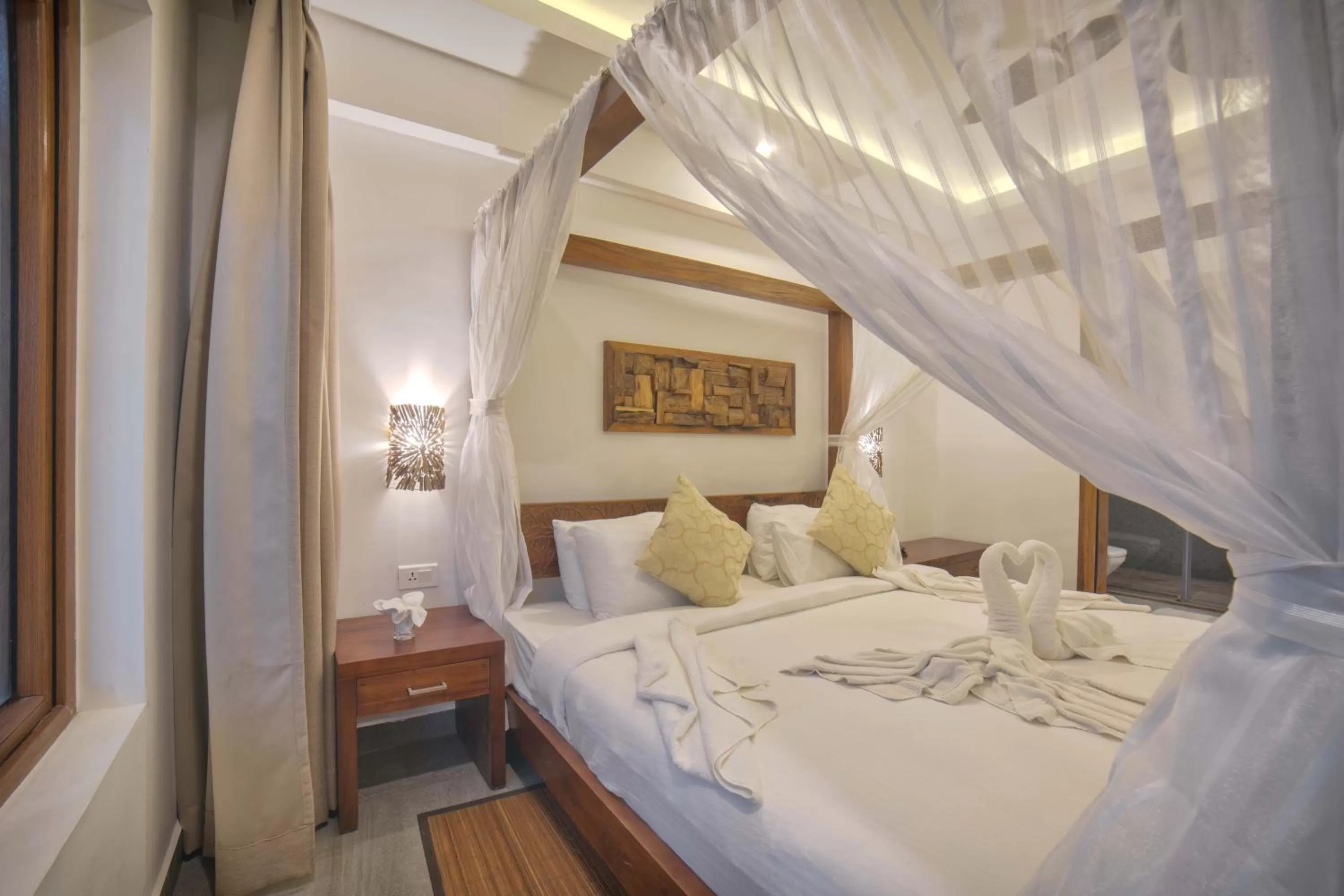 Bed in Elixir Hills Suites Resort and Spa