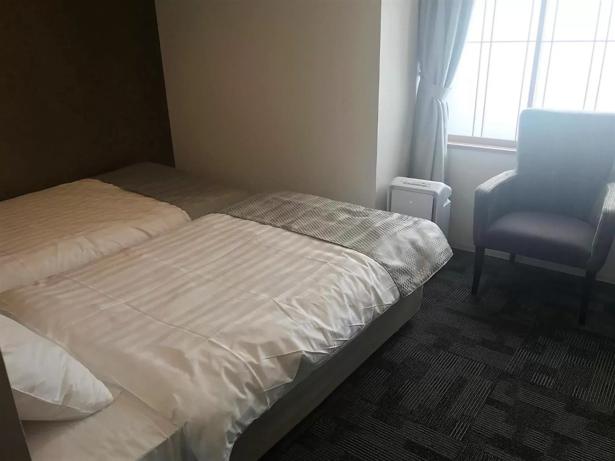 Bed in New Tomakomai Prince Hotel NAGOMI