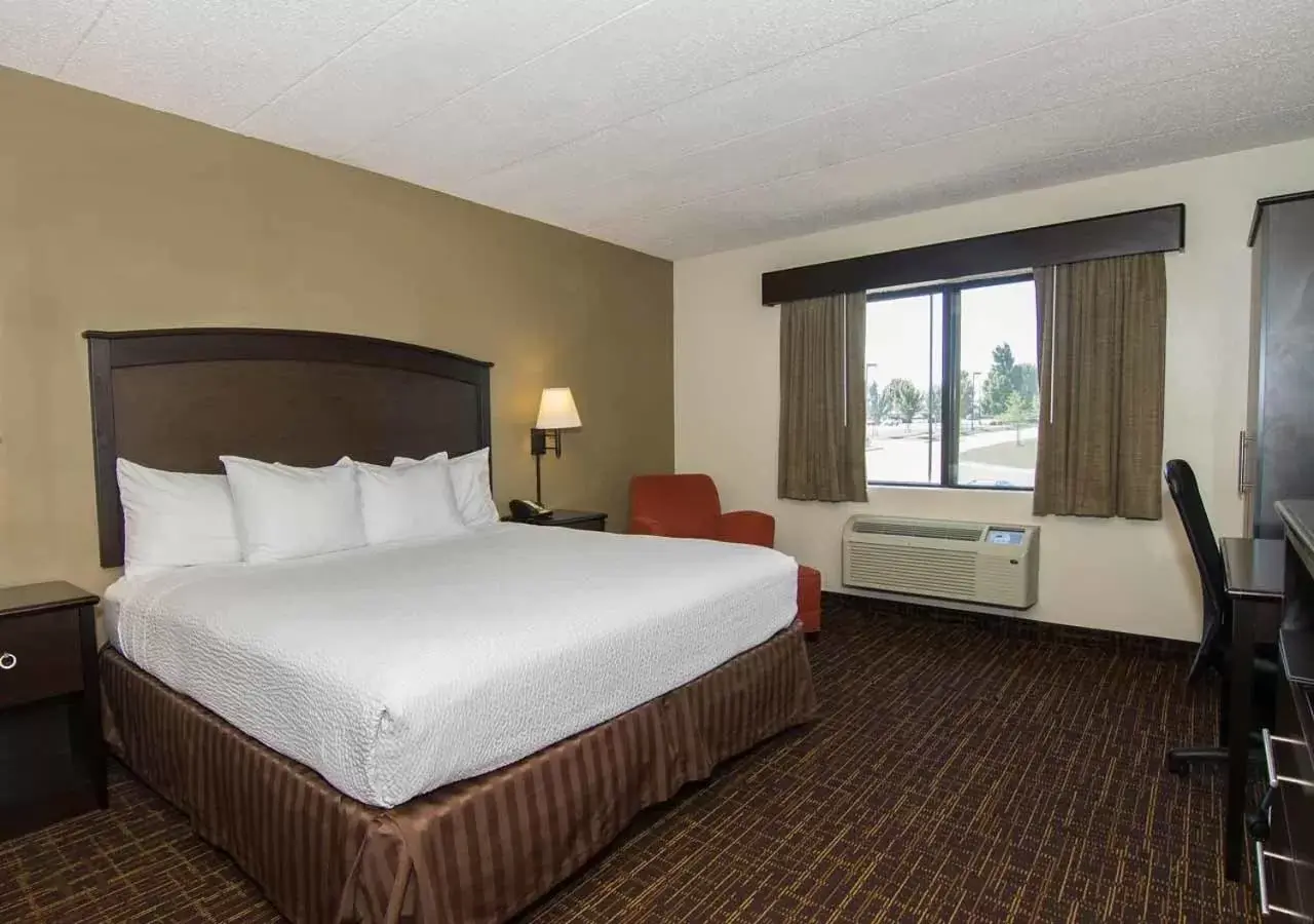 Bed in AmericInn by Wyndham Peoria