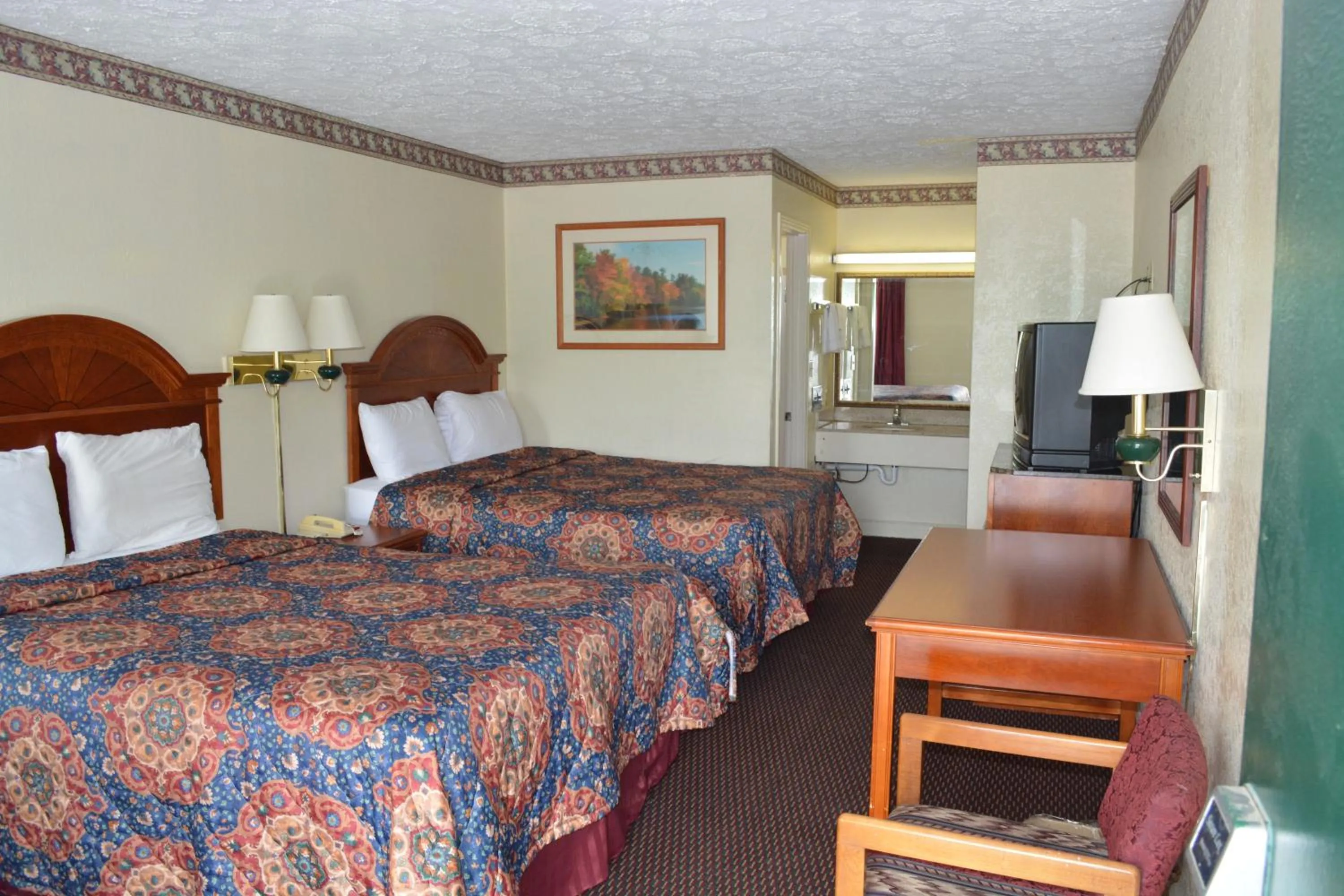 Bed in Knights Inn Hurricane Mills