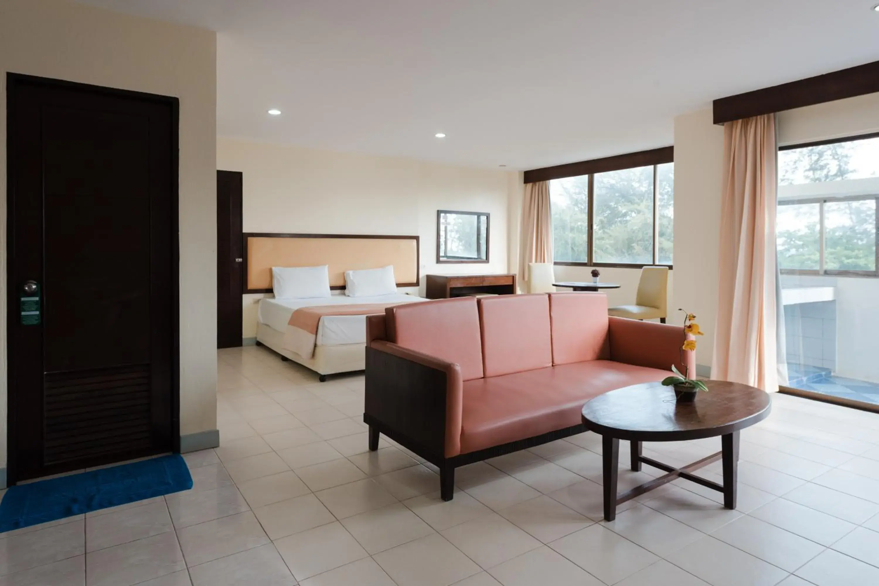 Bed, Seating Area in Nice Beach Hotel