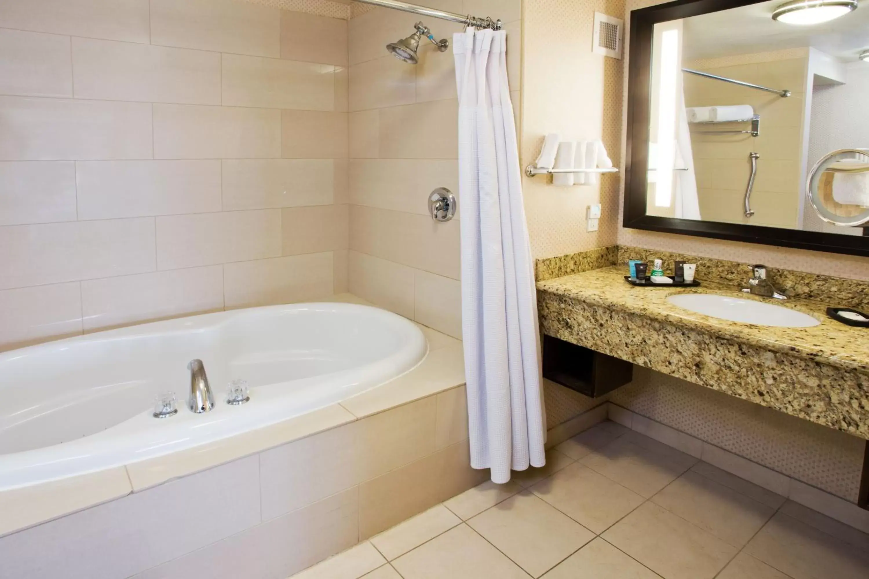 Bedroom, Bathroom in Crowne Plaza Anchorage-Midtown, an IHG Hotel
