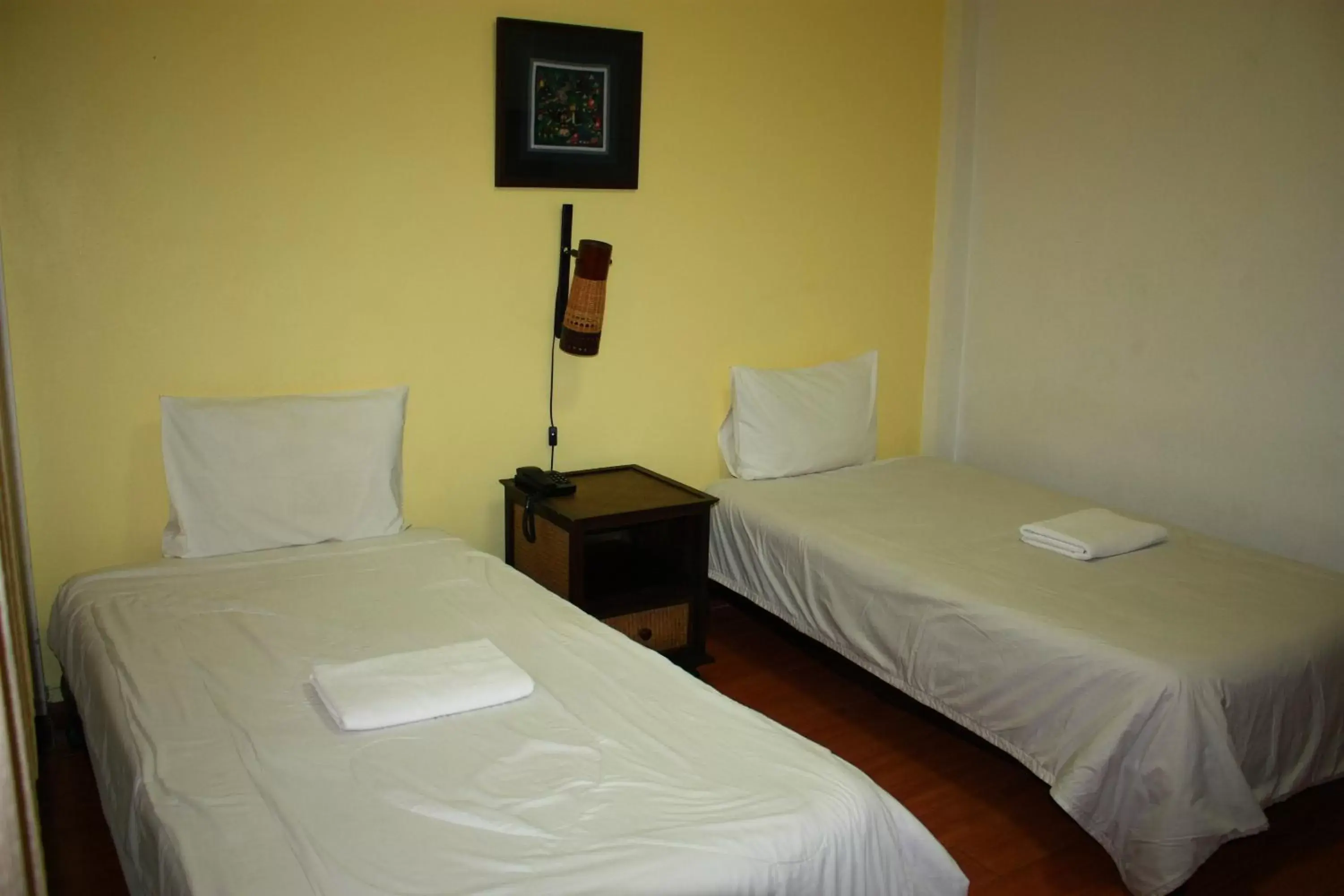 Bed in โรงแรมตีฆ้อง - Tri Gong Hotel Bed in โรงแรมตีฆ้อง - Tri Gong Hotel