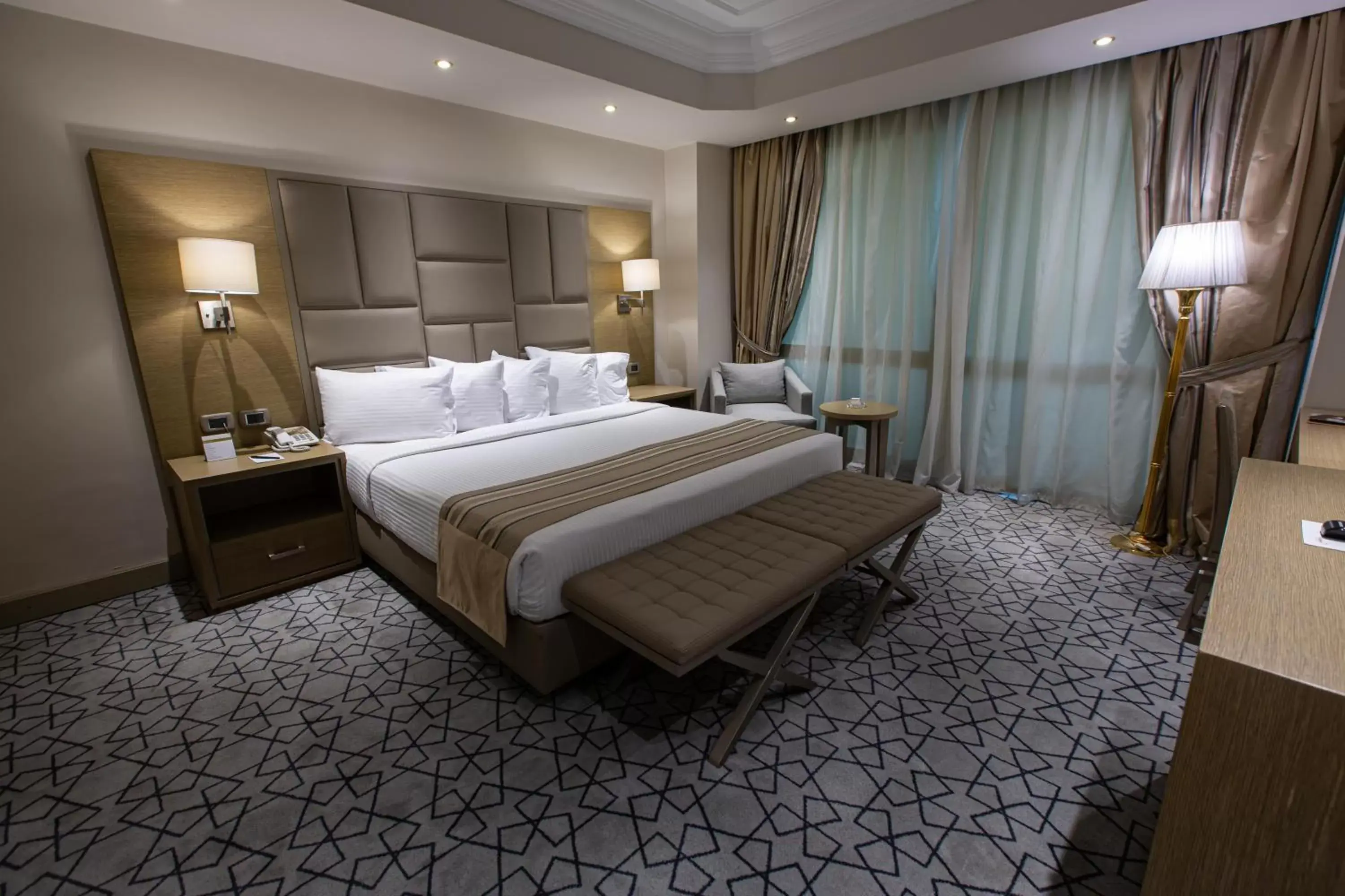 Photo of the whole room, Bed in Triumph Plaza Hotel