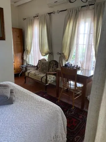 Seating area, Bed in A Tapestry Garden Guest House