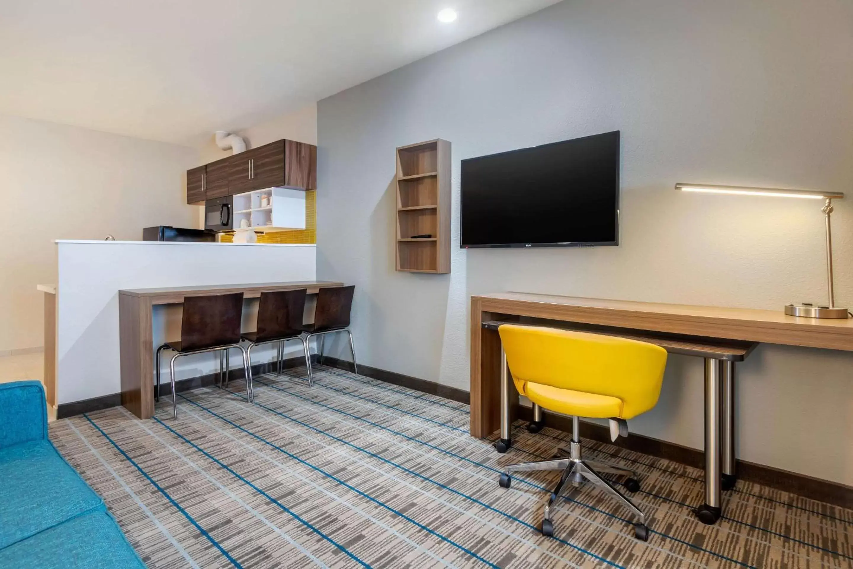 Photo of the whole room, TV/Entertainment Center in MainStay Suites Bricktown - near Medical Center