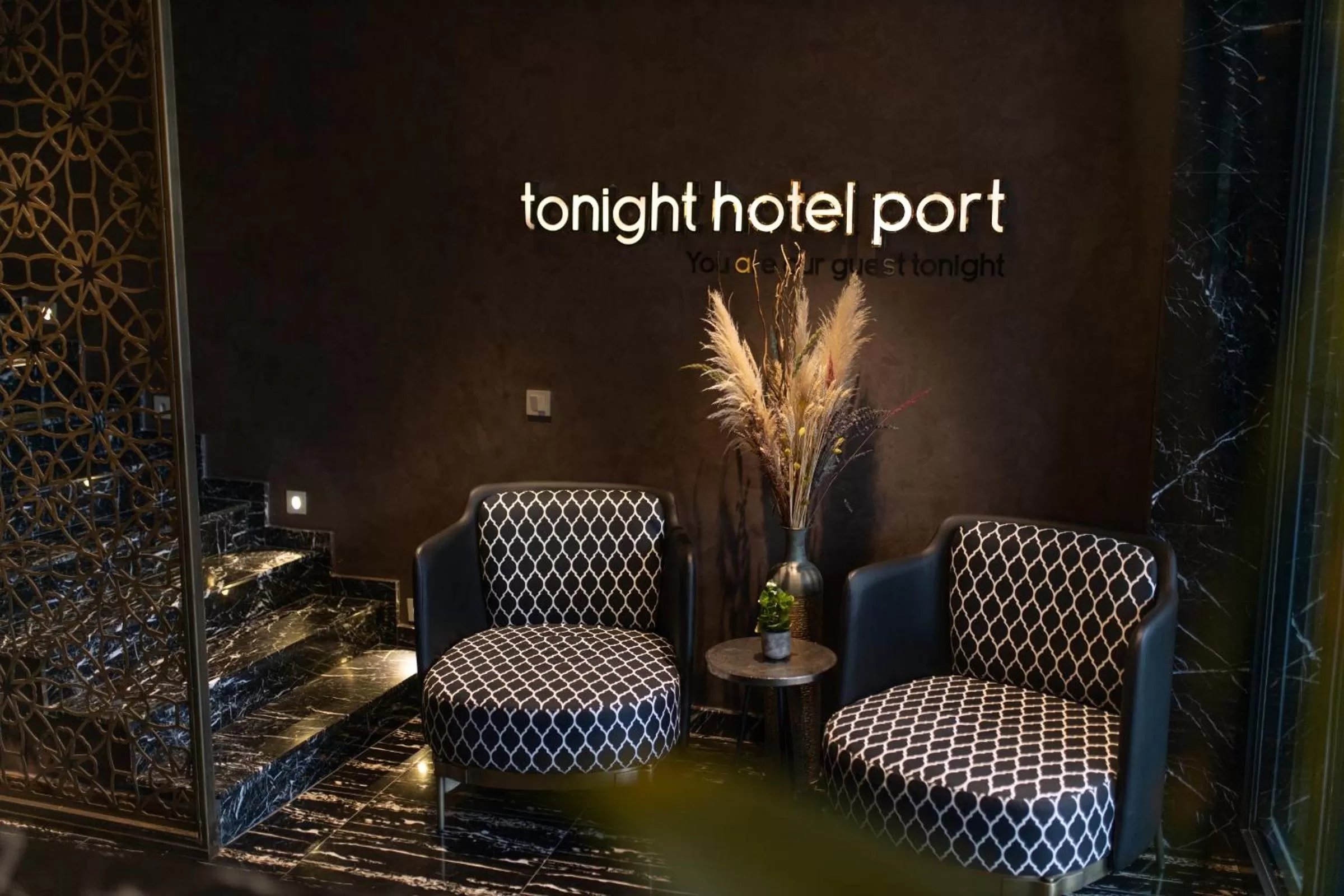 Property logo or sign in Tonight Hotel Port
