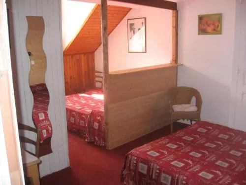 Photo of the whole room, Bed in Hôtel du Centre