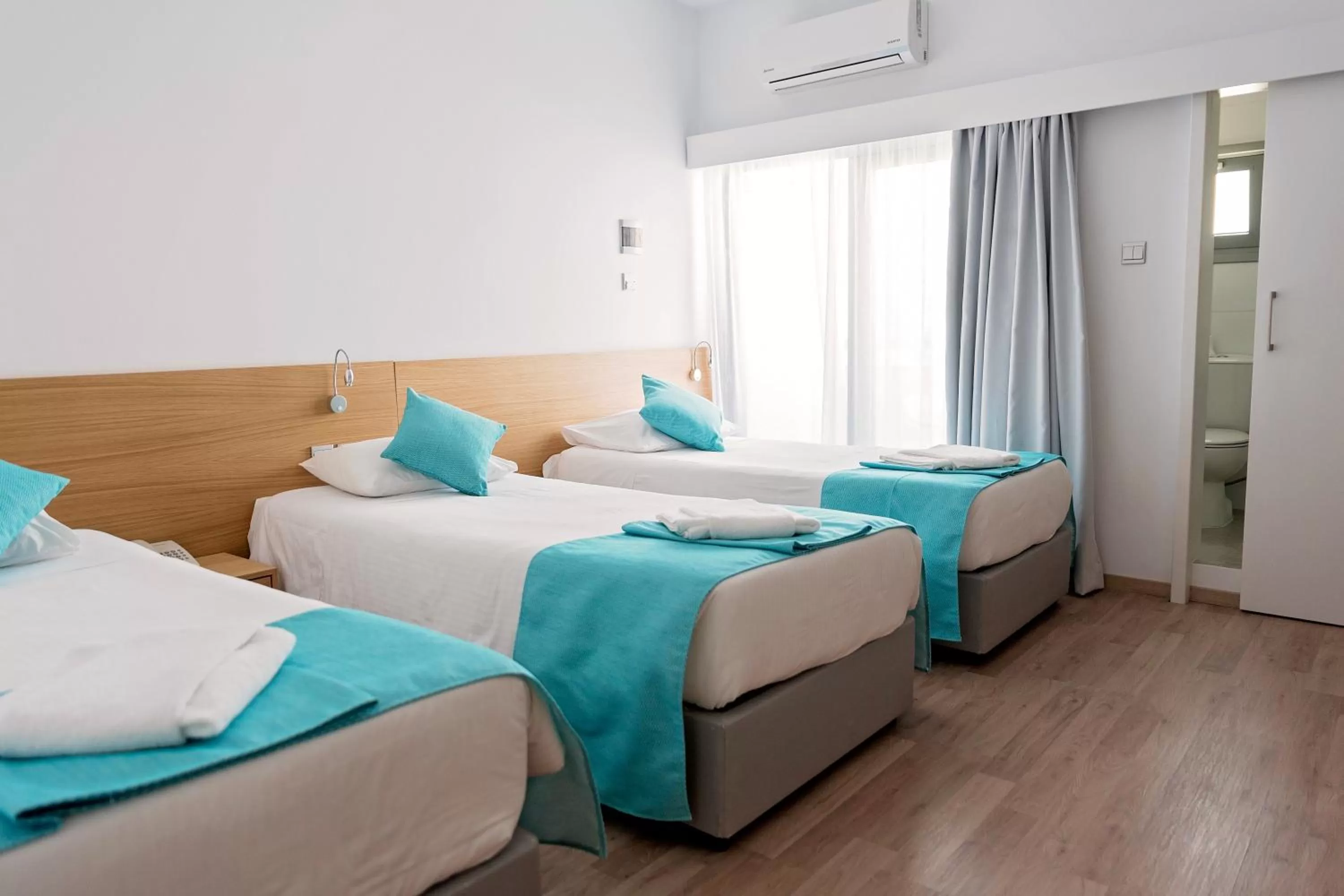 Bed in Pyramos Hotel