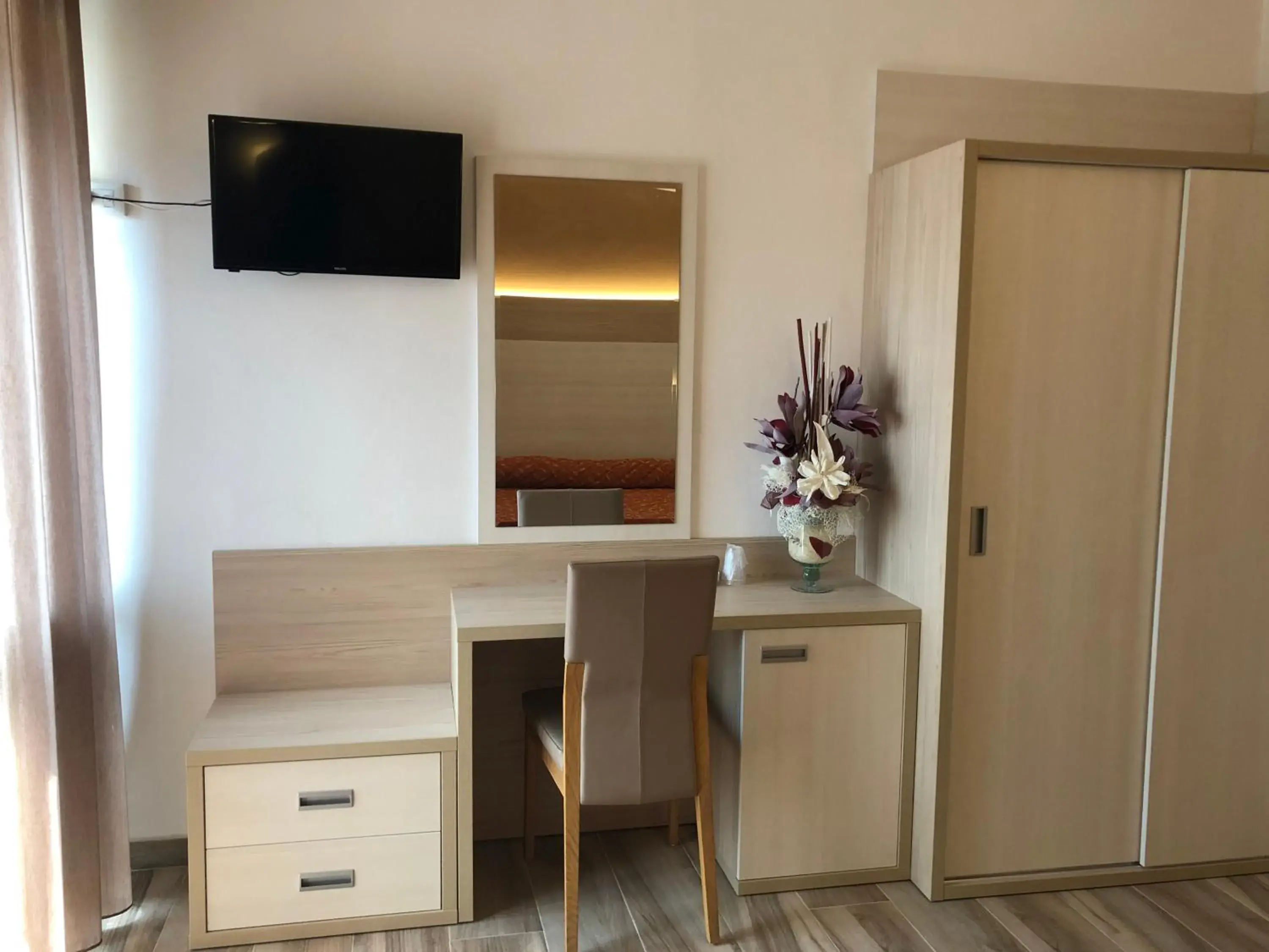 TV and multimedia, TV/Entertainment Center in Hotel Palazzina
