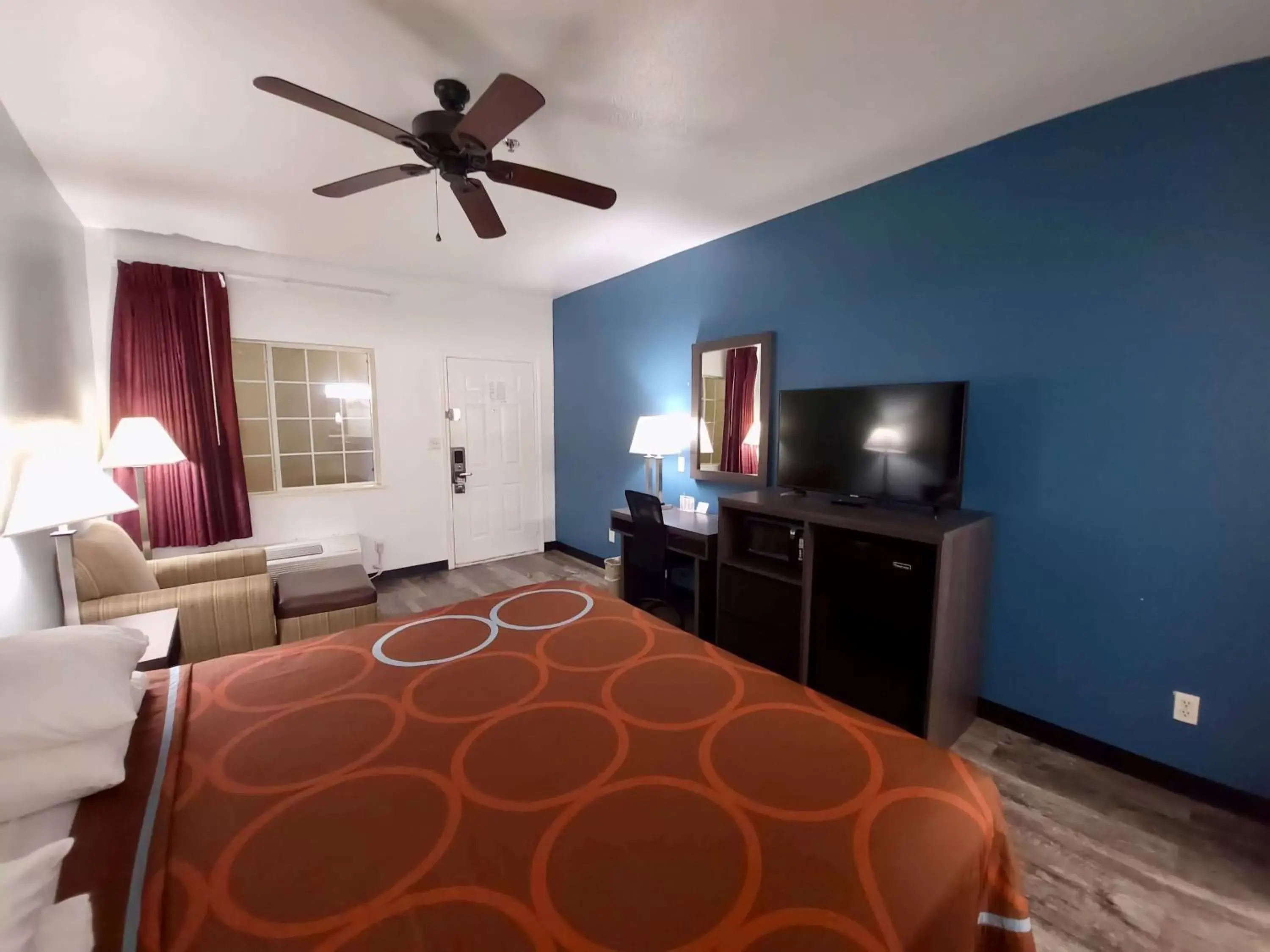 Photo of the whole room, TV/Entertainment Center in Super 8 by Wyndham Forney/East Dallas