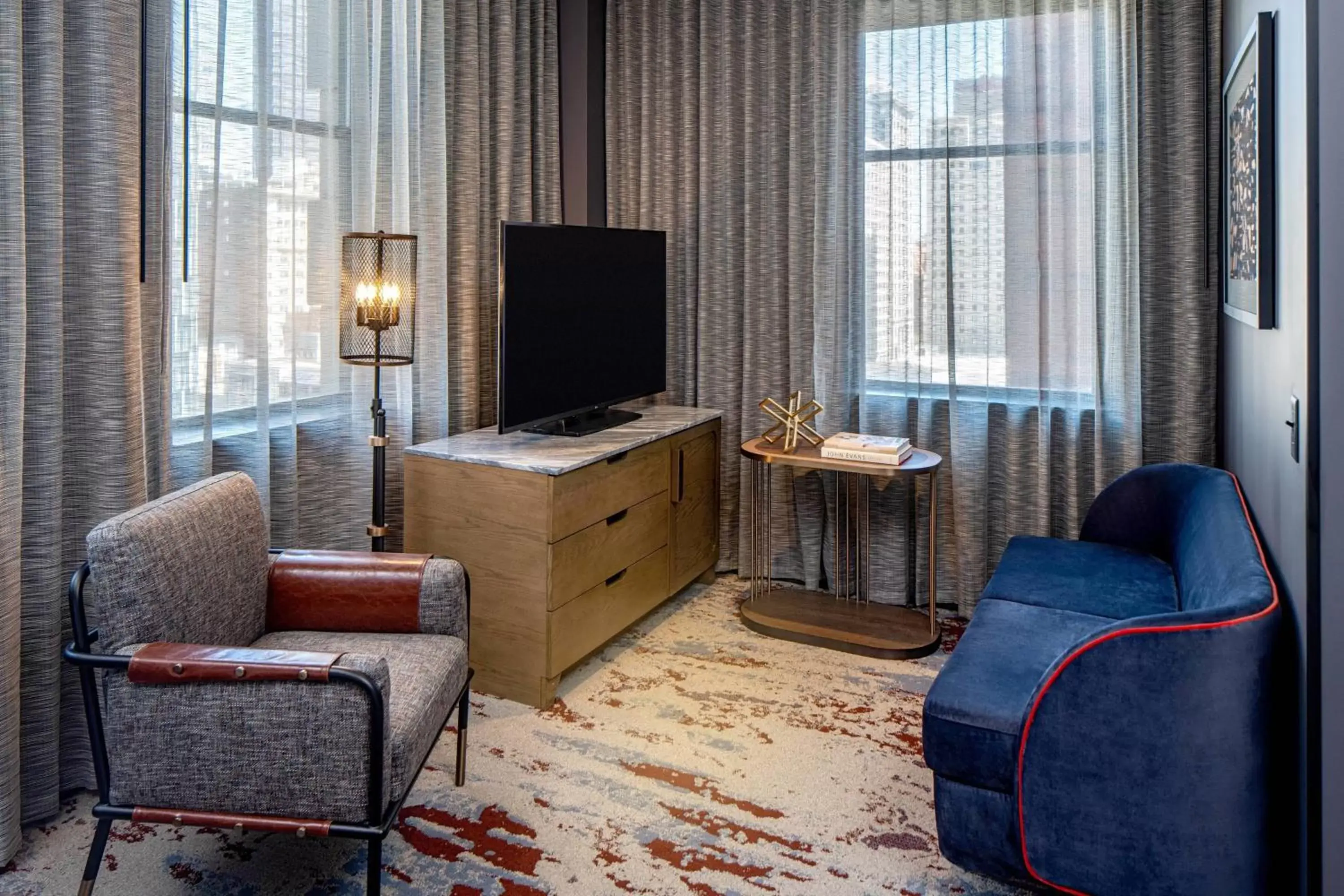 Photo of the whole room, Seating Area in The Industrialist Hotel, Pittsburgh, Autograph Collection